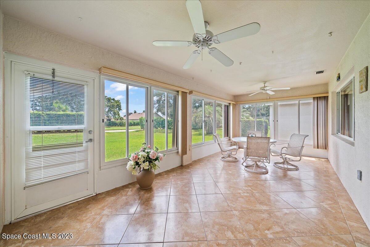 1643 Keys Gate Drive Melbourne, FL 32940 - Photo 30 of 43 a lobby with furniture and floor to ceiling window