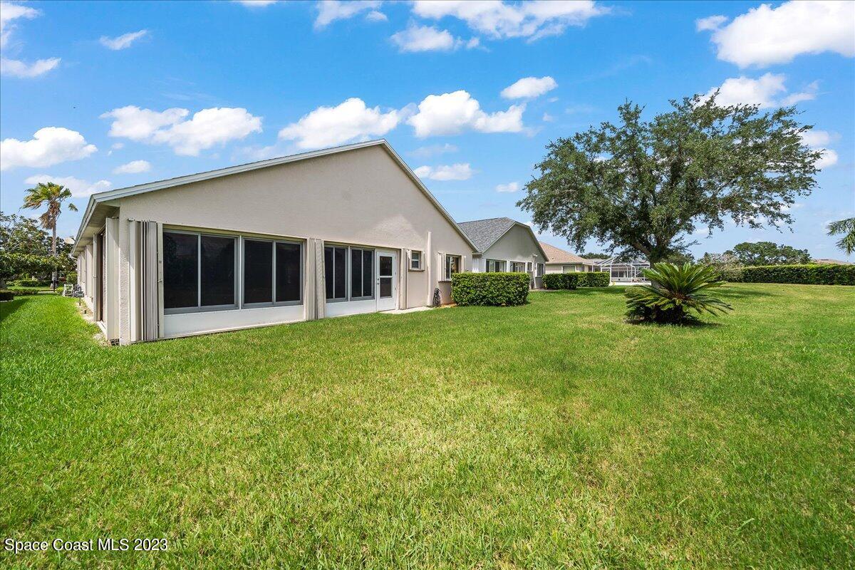 1643 Keys Gate Drive Melbourne, FL 32940 - Photo 31 of 43 a view of a house with a backyard