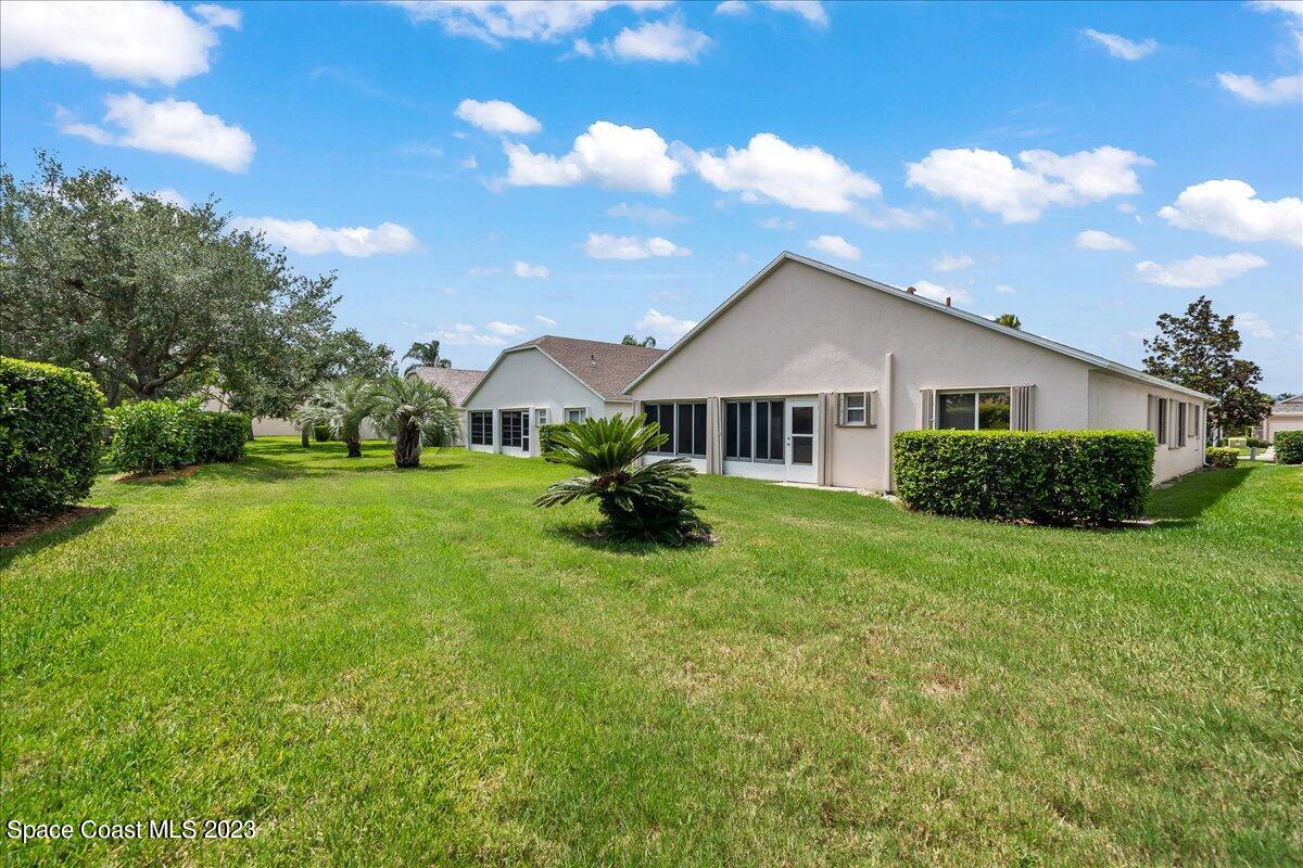 1643 Keys Gate Drive Melbourne, FL 32940 - Photo 32 of 43 a front view of house with yard and green space