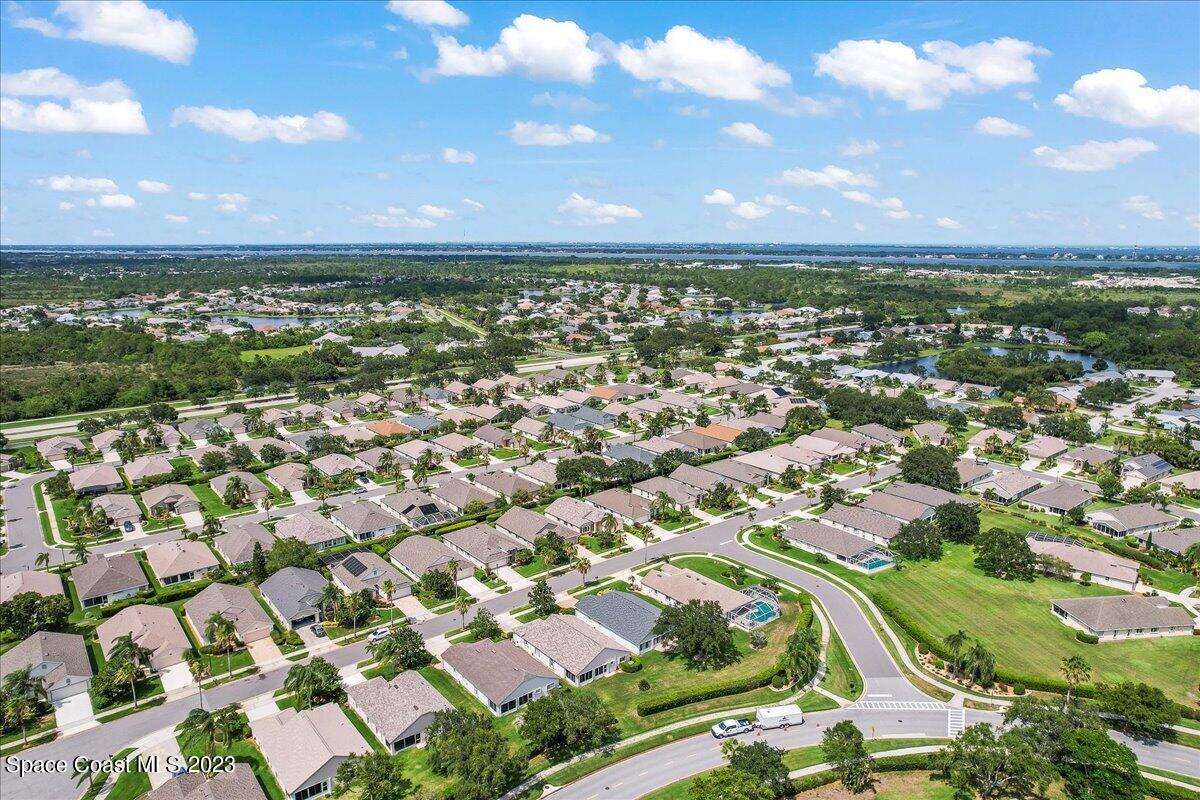 1643 Keys Gate Drive Melbourne, FL 32940 - Photo 39 of 43 an aerial view of residential houses with outdoor space and trees