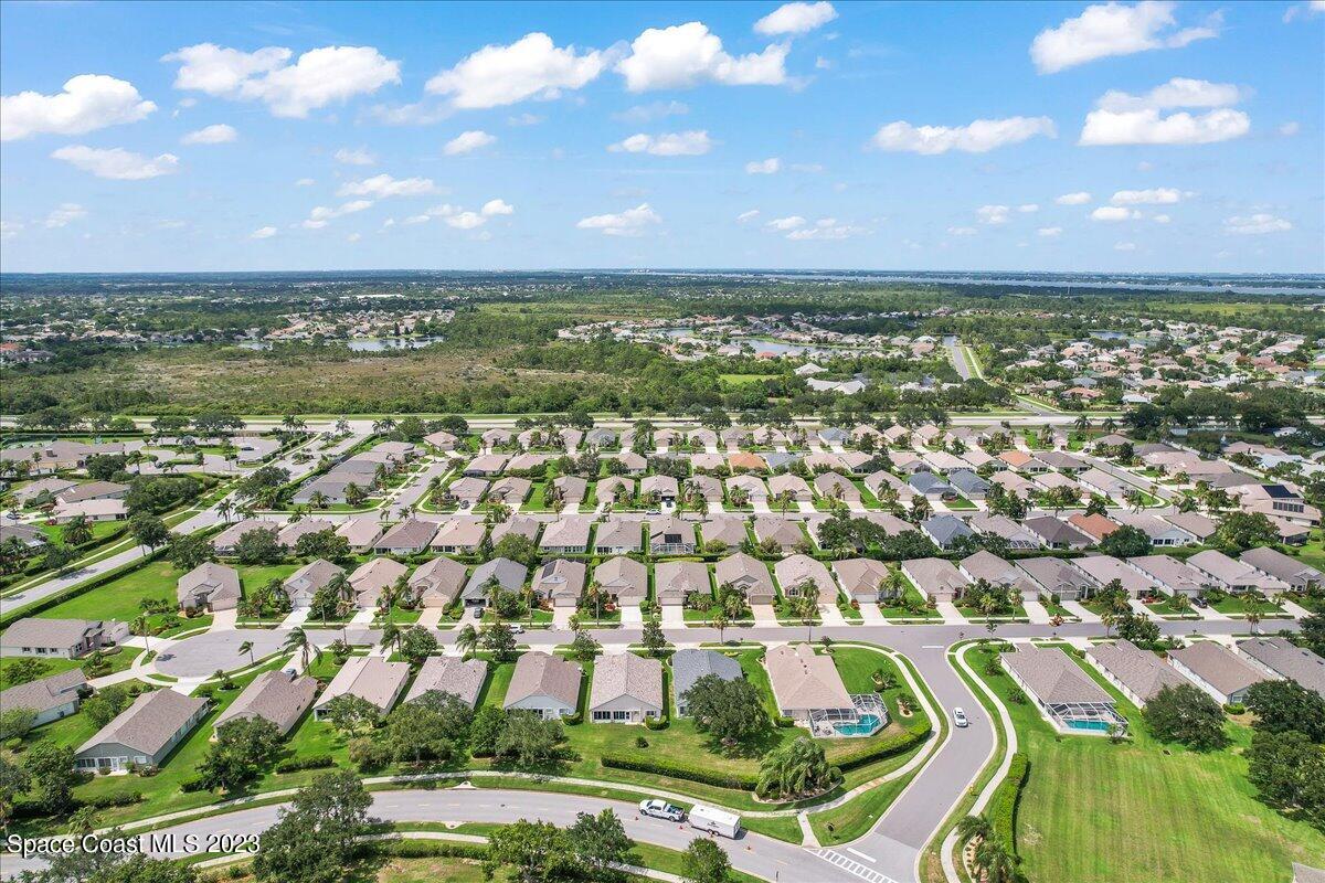 1643 Keys Gate Drive Melbourne, FL 32940 - Photo 40 of 43 an aerial view of residential houses with outdoor space and trees