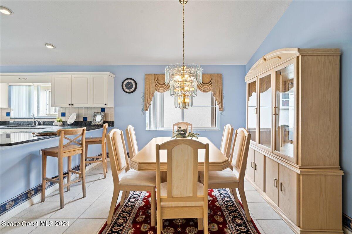 1643 Keys Gate Drive Melbourne, FL 32940 - Photo 5 of 43 a view of a dining room with furniture window and outside view