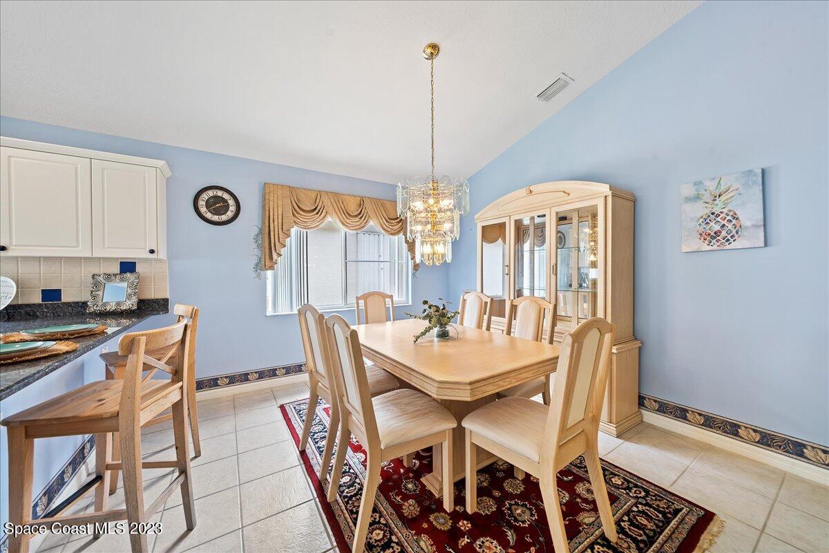 1643 Keys Gate Drive Melbourne, FL 32940 - Photo 7 of 43 a view of a dining room with furniture and window