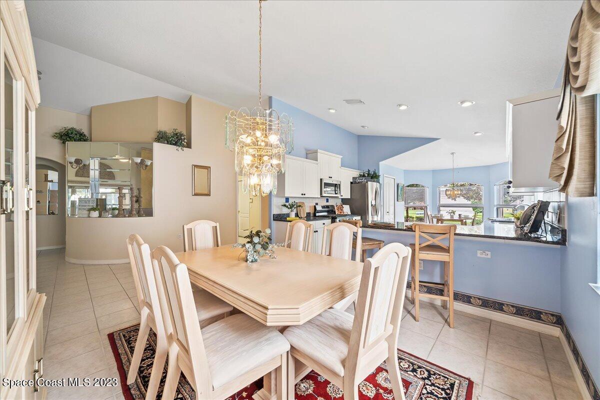 1643 Keys Gate Drive Melbourne, FL 32940 - Photo 8 of 43 a dining room with furniture and window
