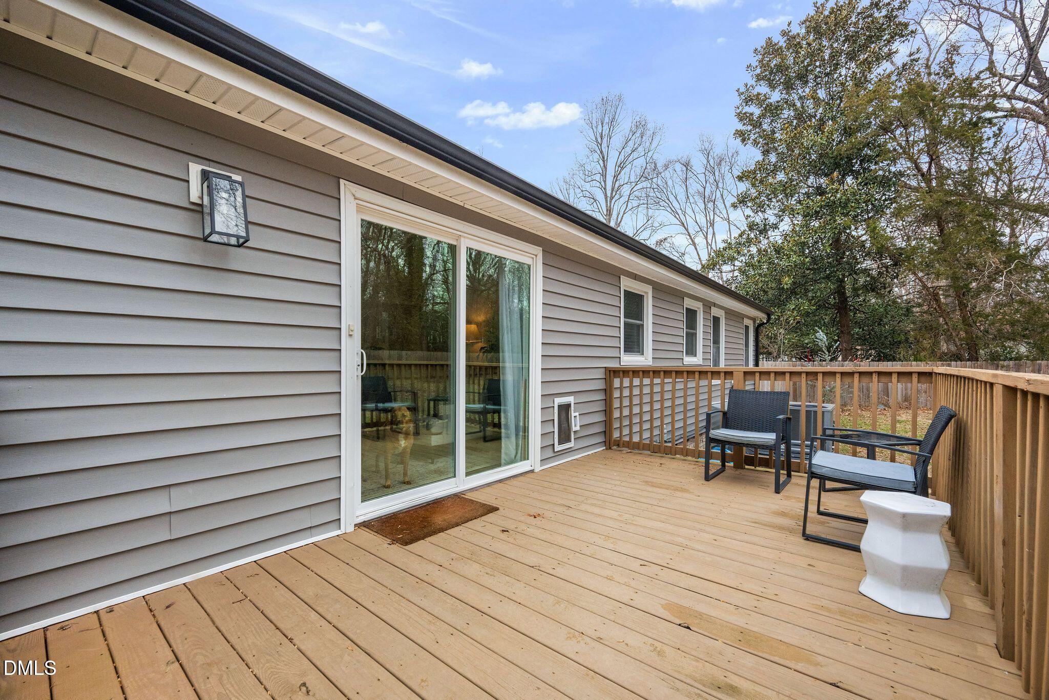 5620 Old Forge Circle Raleigh, NC 27609 - Photo 10 of 46 a balcony with wooden floor table and chairs