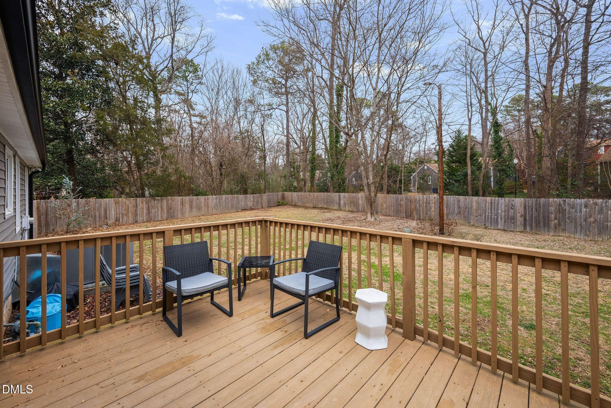 5620 Old Forge Circle Raleigh, NC 27609 - Photo 11 of 46 a balcony with wooden floor and outdoor seating