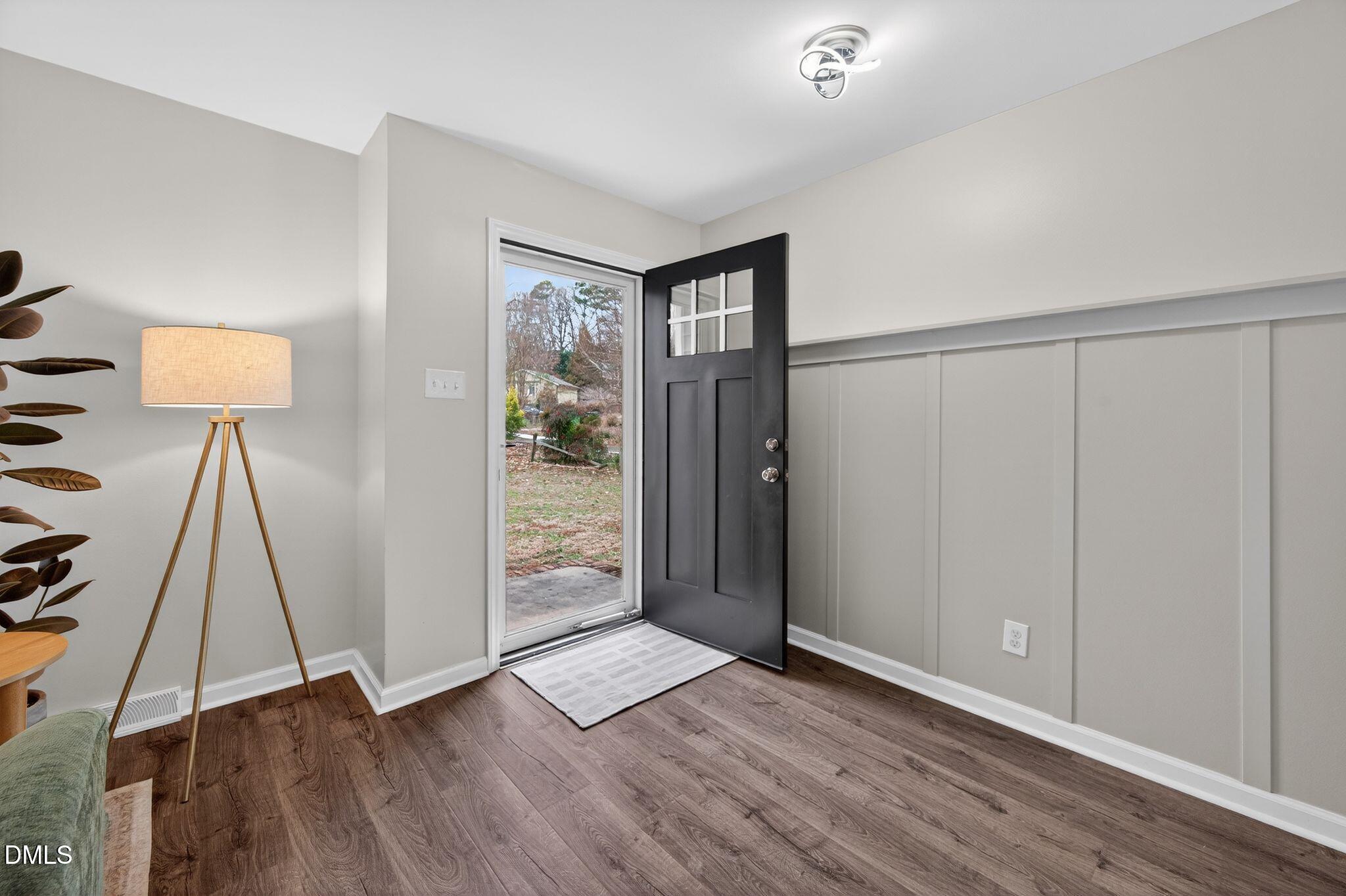 5620 Old Forge Circle Raleigh, NC 27609 - Photo 12 of 46 a view of an empty room with wooden floor and a fan