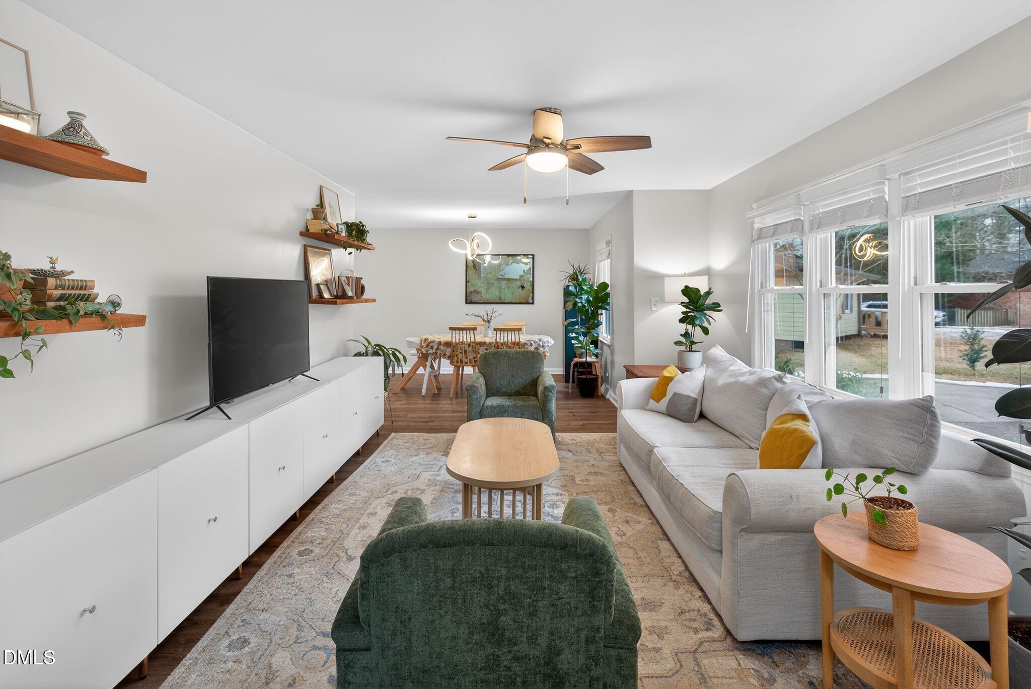 5620 Old Forge Circle Raleigh, NC 27609 - Photo 13 of 46 a living room with furniture and a large window