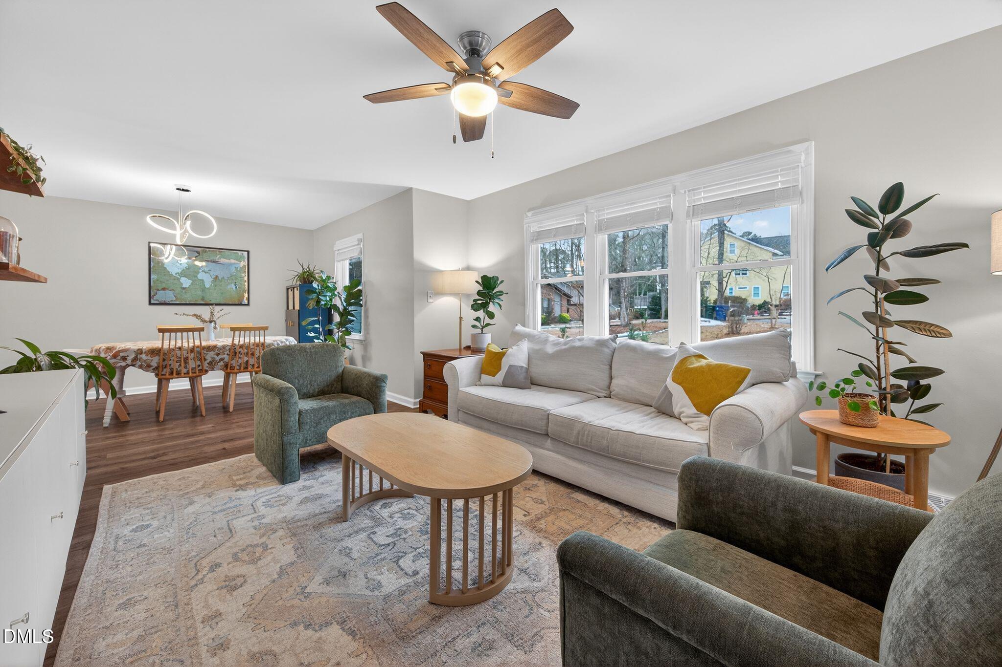 5620 Old Forge Circle Raleigh, NC 27609 - Photo 14 of 46 a living room with furniture and a large window