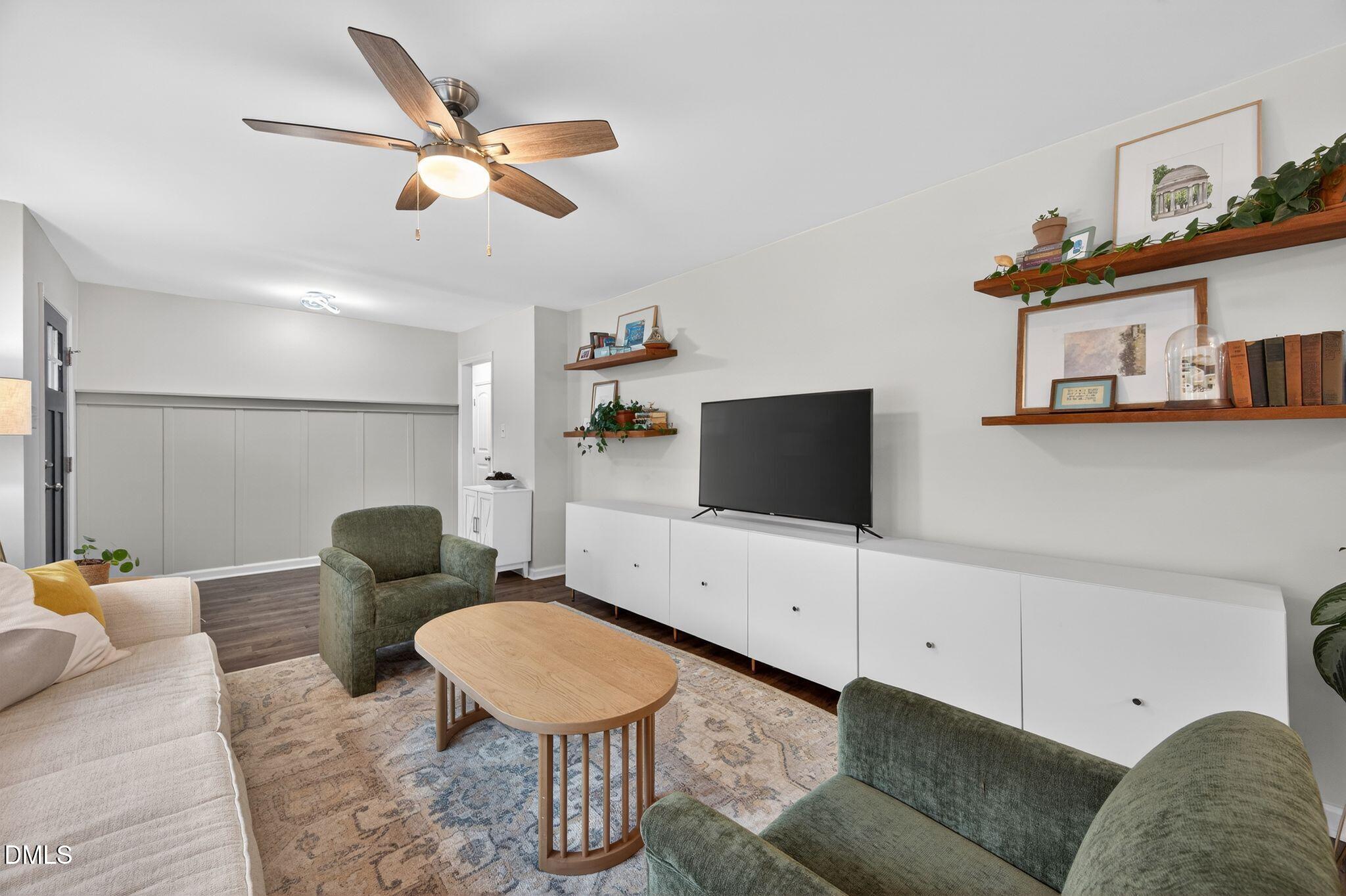 5620 Old Forge Circle Raleigh, NC 27609 - Photo 16 of 46 a living room with furniture and a flat screen tv