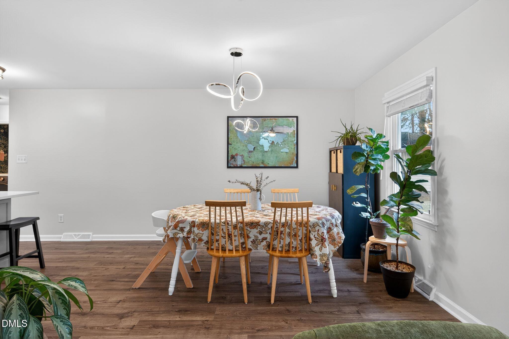 5620 Old Forge Circle Raleigh, NC 27609 - Photo 18 of 46 a view of a dining room with furniture and wooden floor