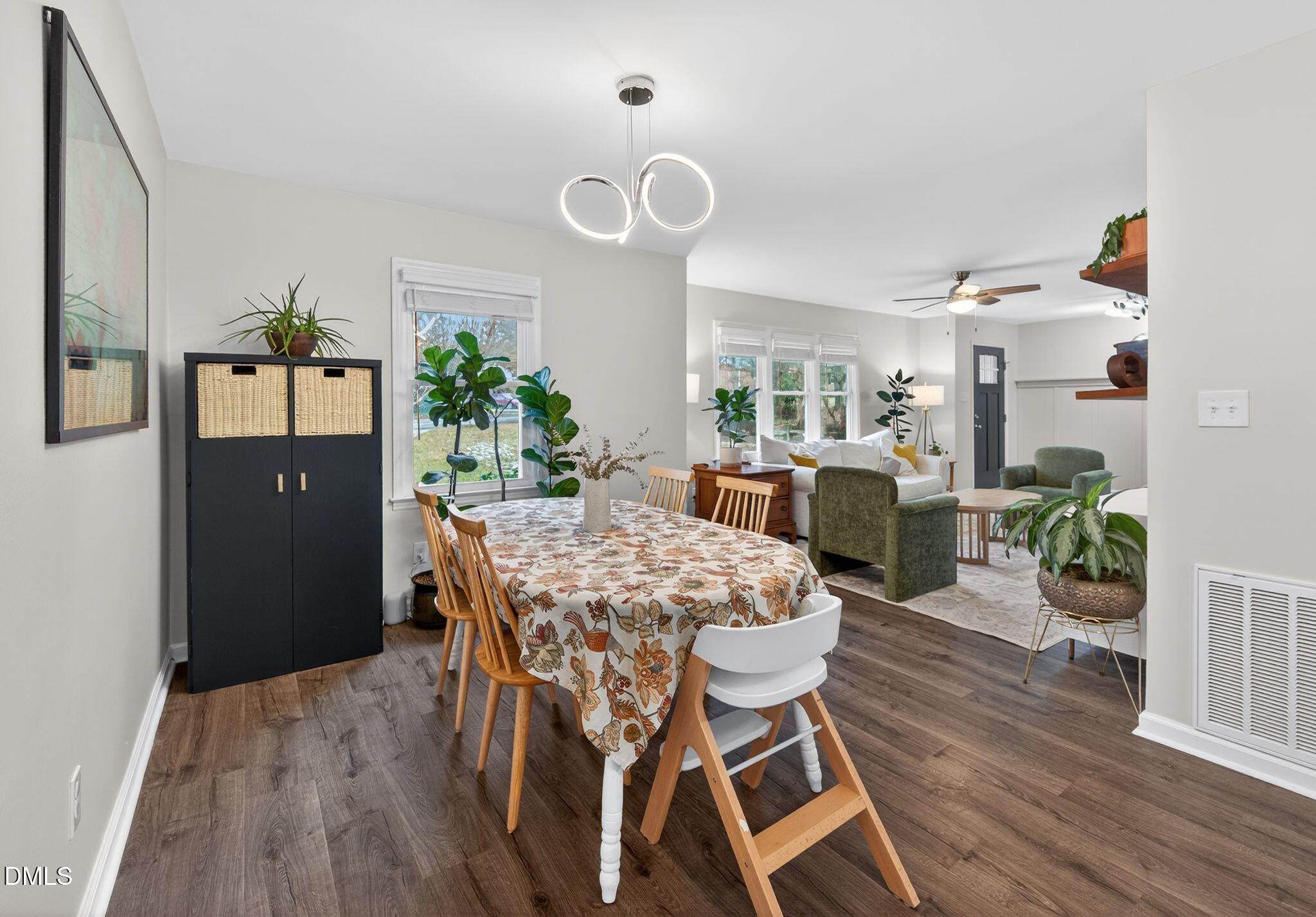 5620 Old Forge Circle Raleigh, NC 27609 - Photo 19 of 46 a view of a dining room with furniture and wooden floor