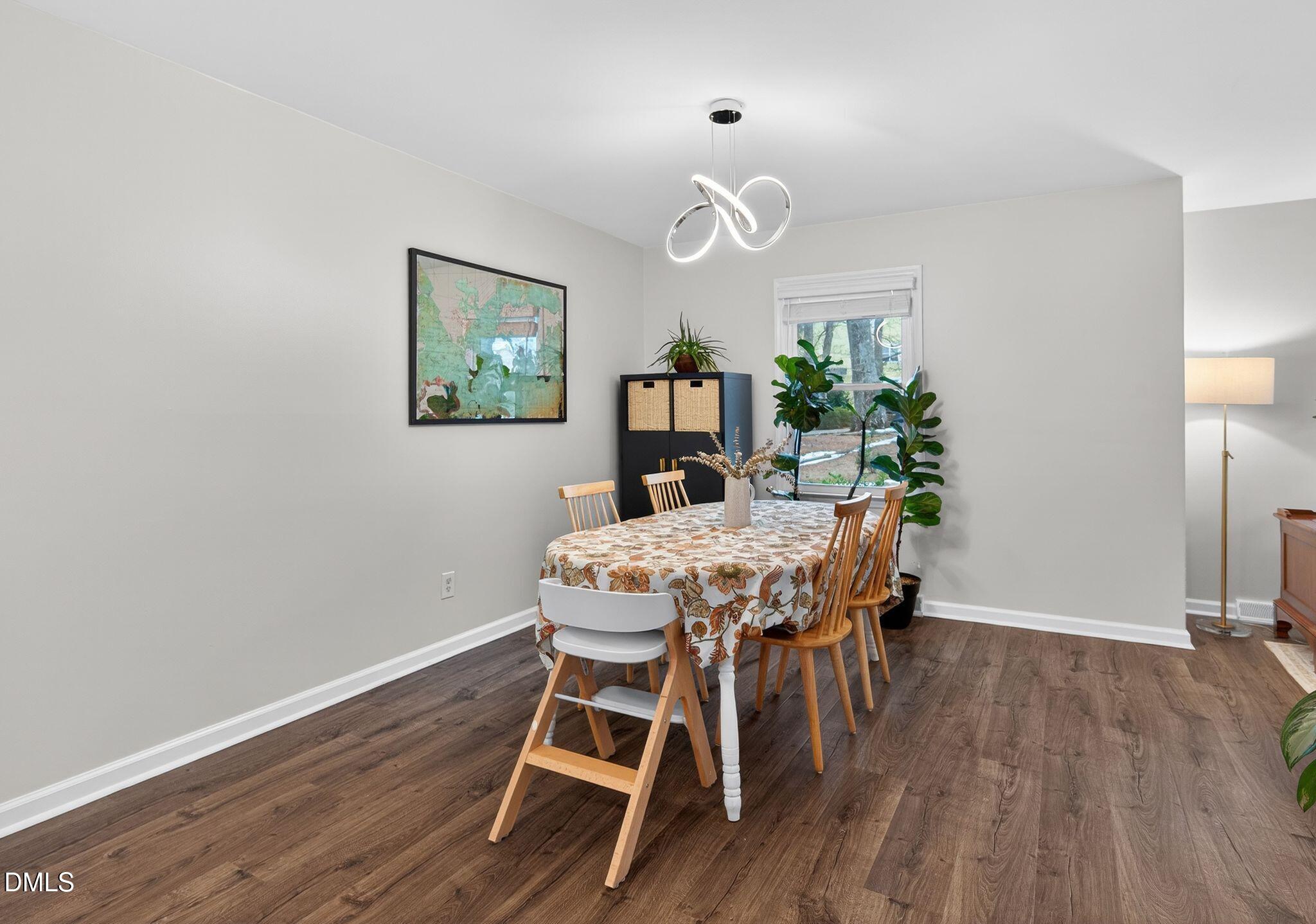 5620 Old Forge Circle Raleigh, NC 27609 - Photo 20 of 46 a view of a dining room with furniture and wooden floor