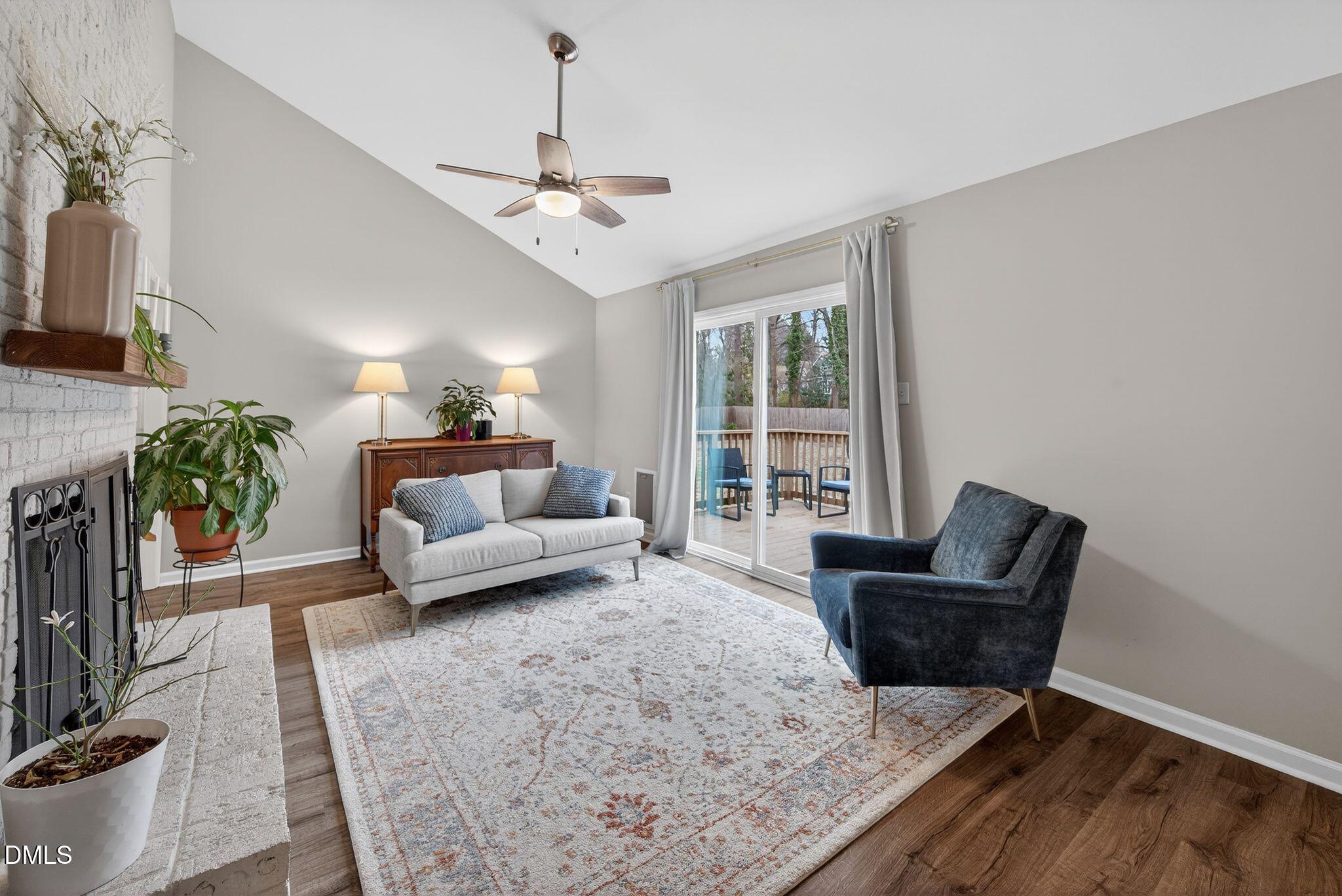 5620 Old Forge Circle Raleigh, NC 27609 - Photo 27 of 46 a living room with furniture and a chandelier