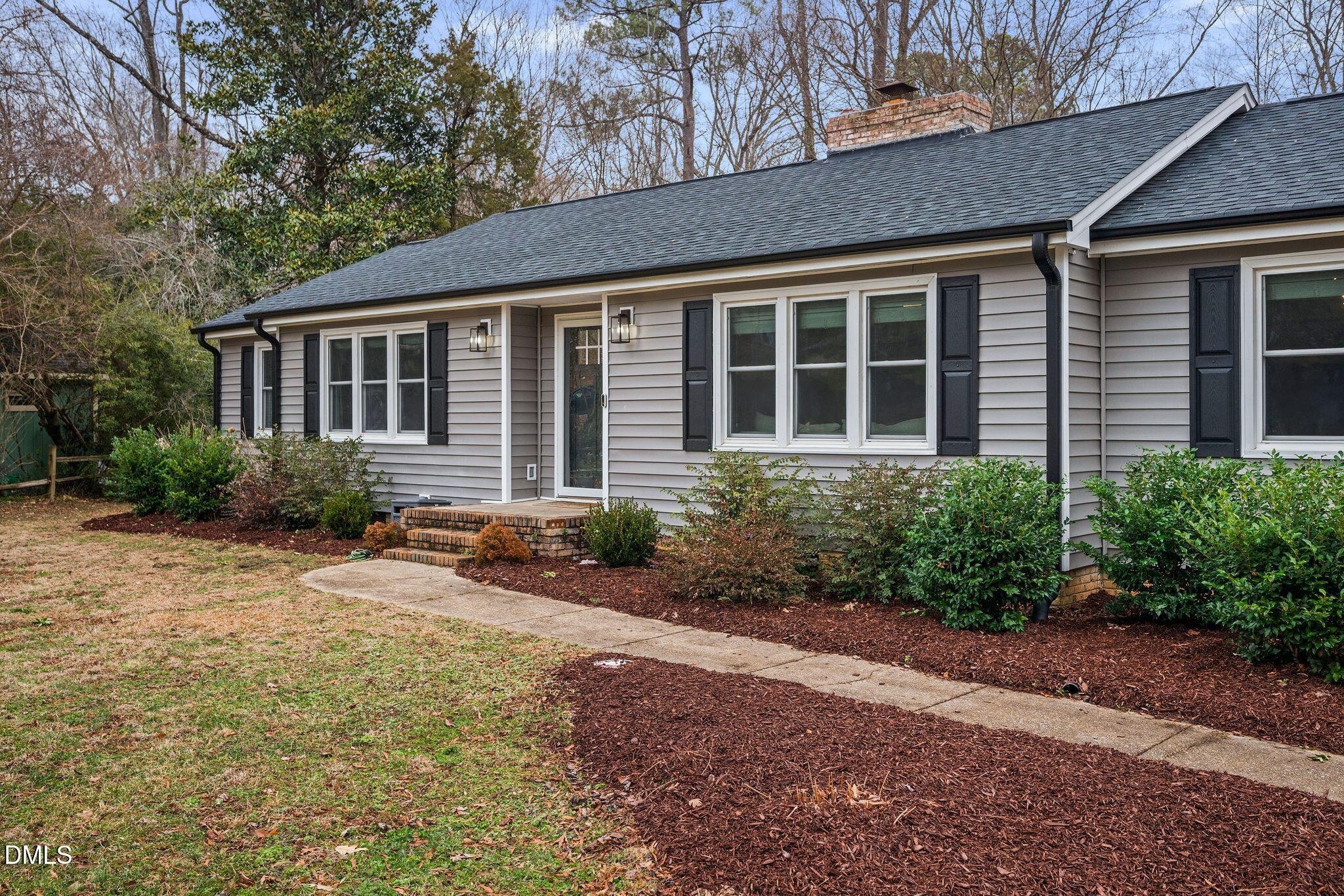 5620 Old Forge Circle Raleigh, NC 27609 - Photo 2 of 46 a view of a house with a yard and plants