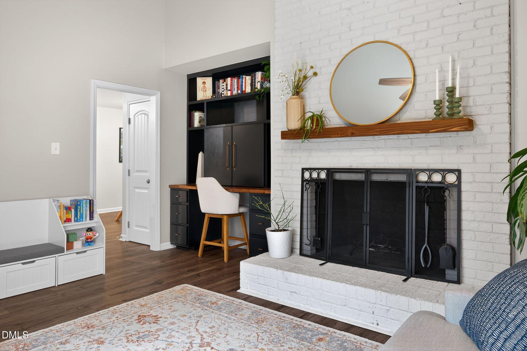 5620 Old Forge Circle Raleigh, NC 27609 - Photo 30 of 46 a living room with furniture and a fireplace