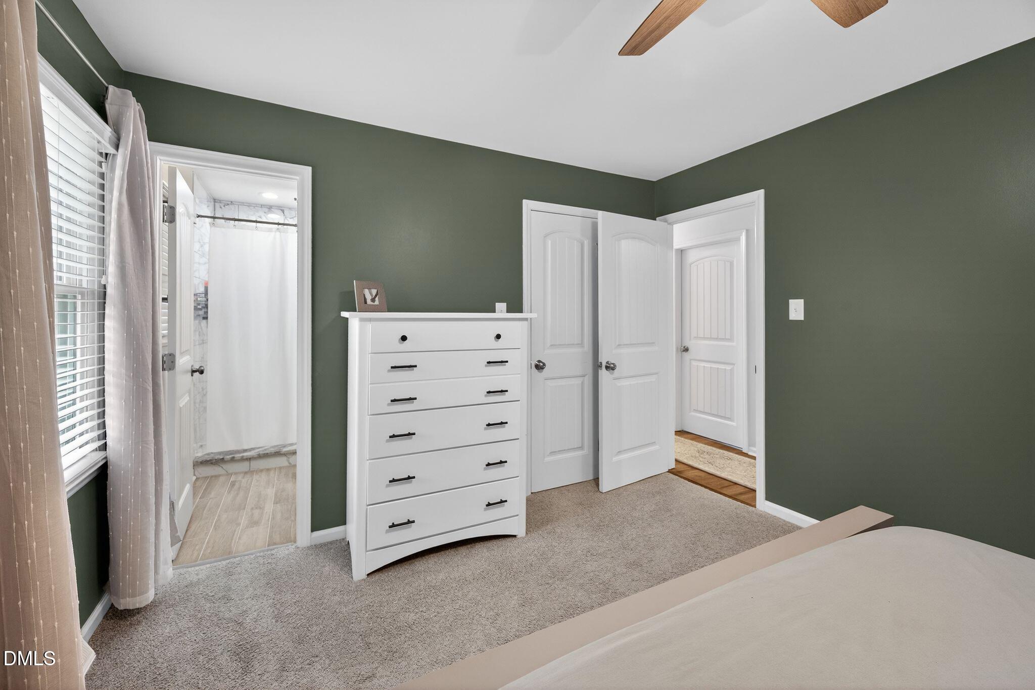5620 Old Forge Circle Raleigh, NC 27609 - Photo 34 of 46 a view of room with cabinet and mirrors