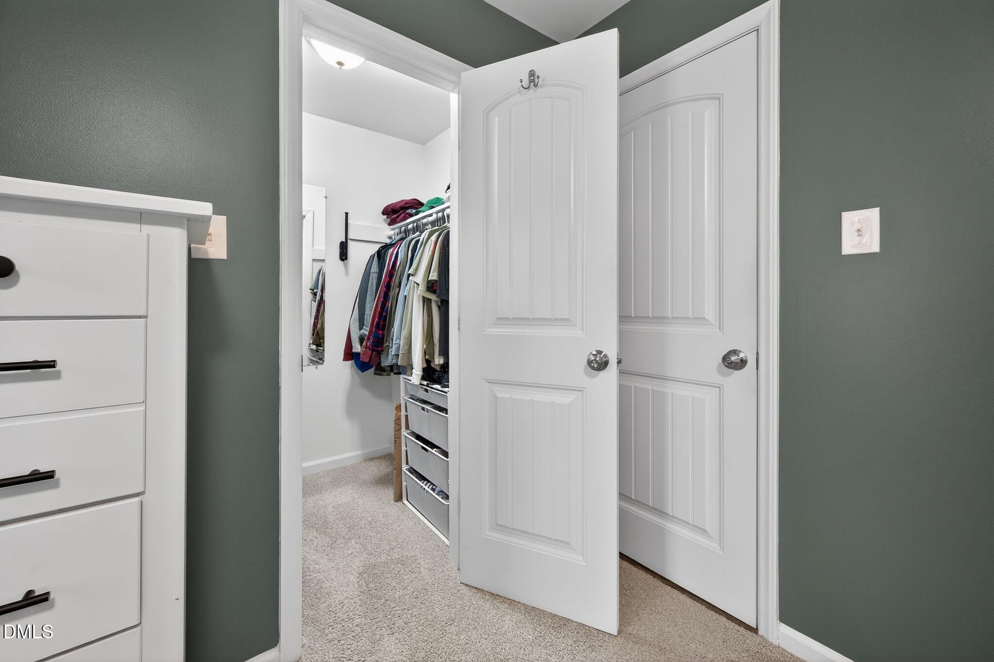5620 Old Forge Circle Raleigh, NC 27609 - Photo 36 of 46 a view of walk in closet with clothes