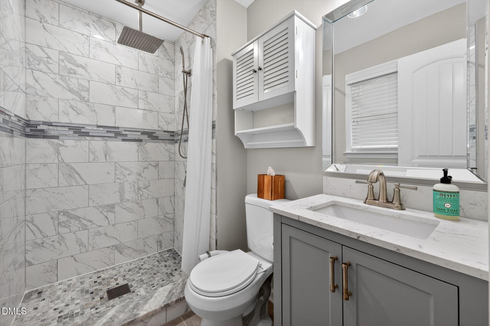 5620 Old Forge Circle Raleigh, NC 27609 - Photo 37 of 46 a bathroom with a sink toilet and shower