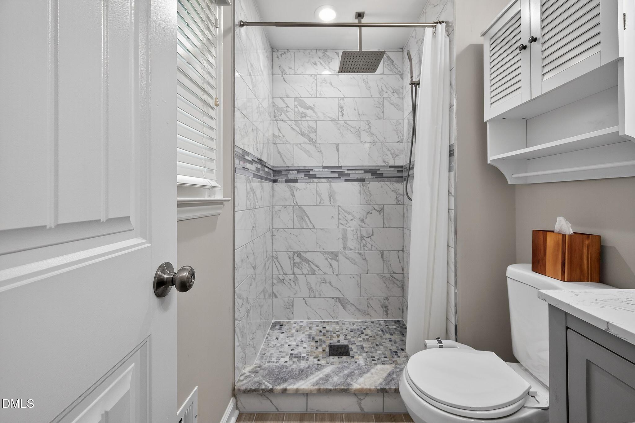 5620 Old Forge Circle Raleigh, NC 27609 - Photo 38 of 46 a bathroom with a toilet and a shower