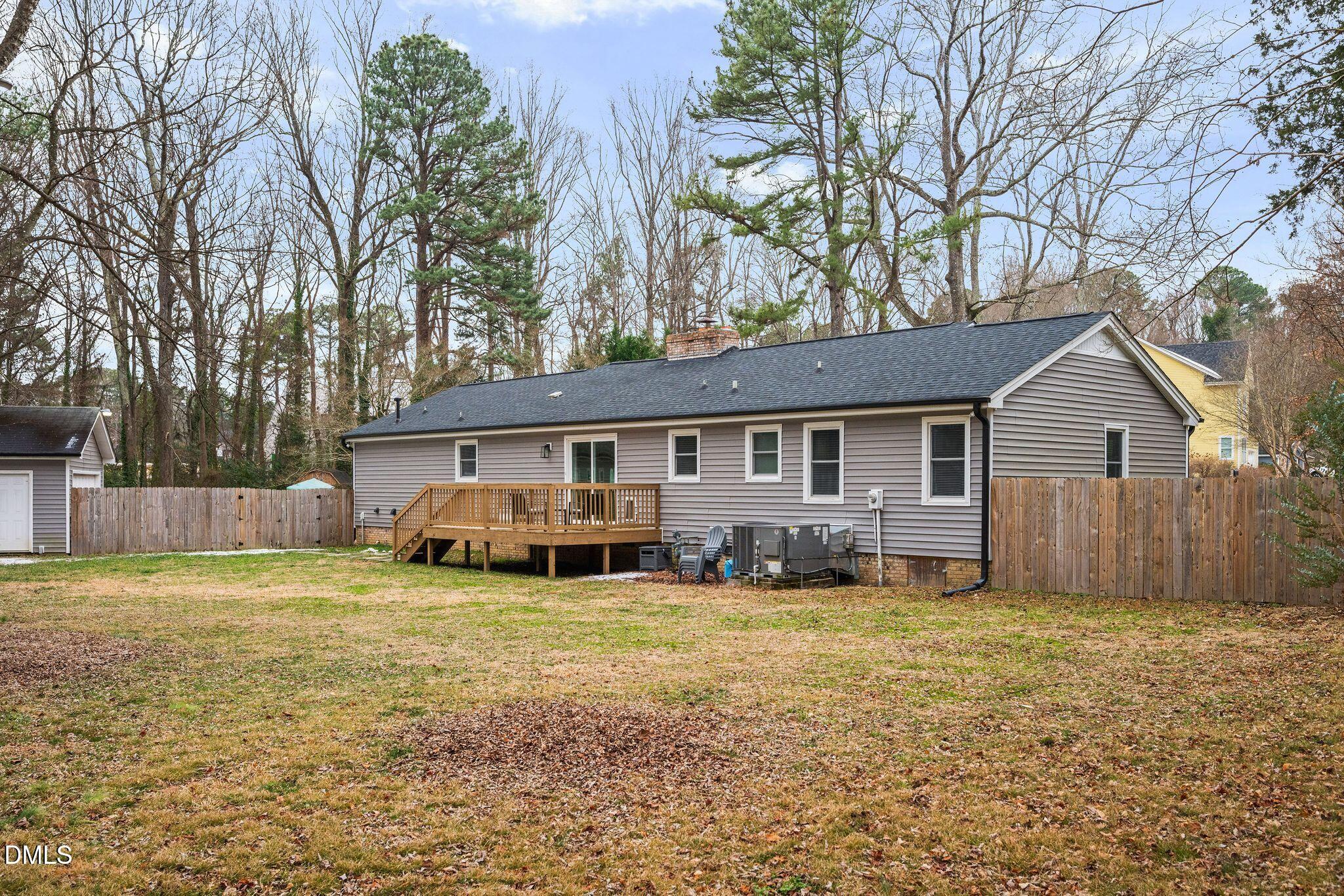 5620 Old Forge Circle Raleigh, NC 27609 - Photo 8 of 46 a view of a house with a yard covered with trees