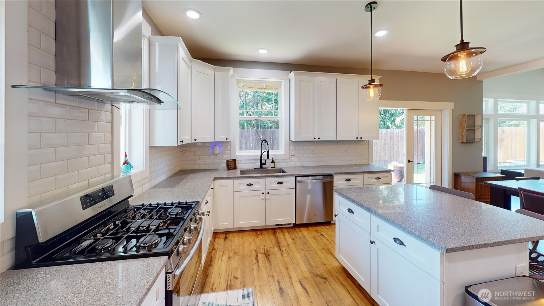 116 Alameda Avenue Fircrest, WA 98466 - Photo 12 of 33 a large kitchen with stainless steel appliances a stove a sink a center island and a stove