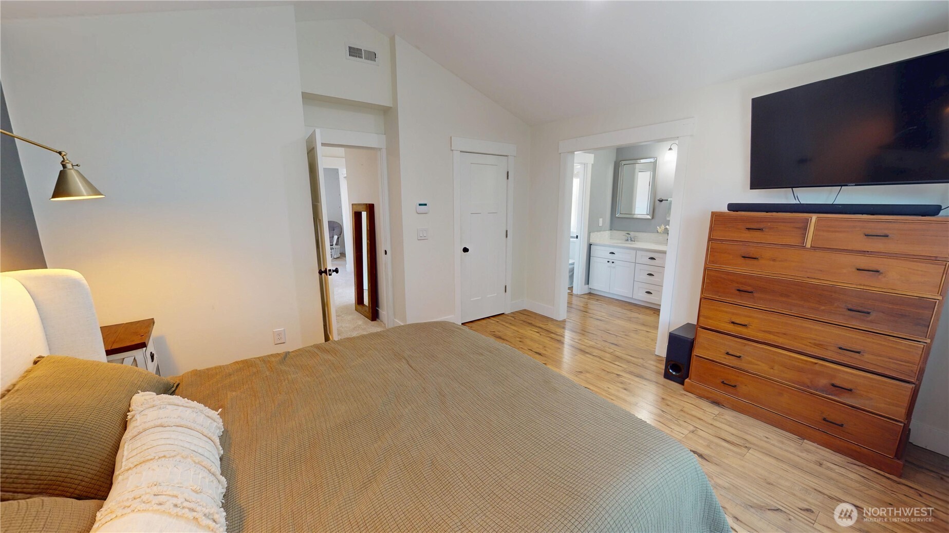 116 Alameda Avenue Fircrest, WA 98466 - Photo 18 of 33 a bedroom with a bed and flat screen tv