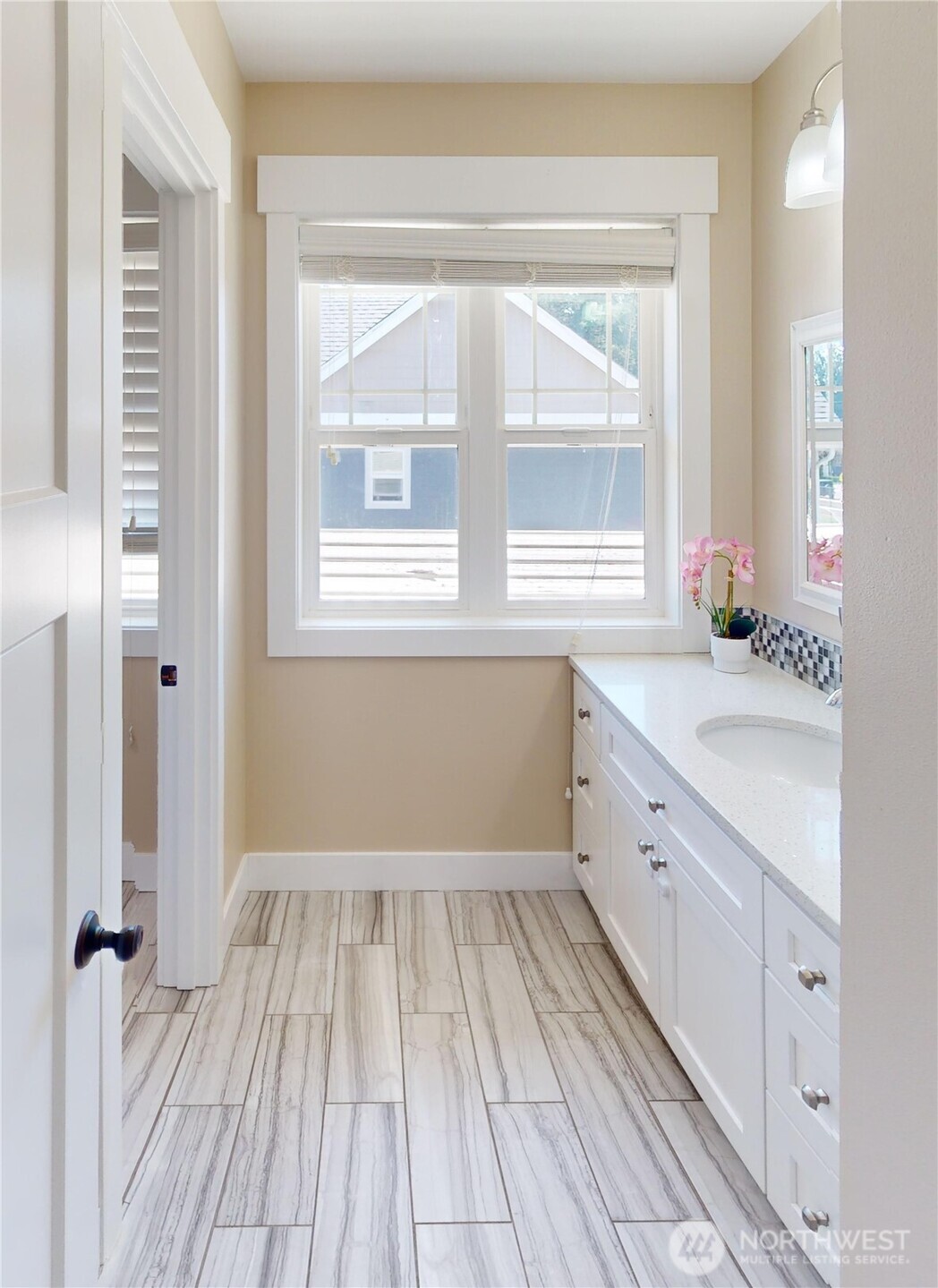 116 Alameda Avenue Fircrest, WA 98466 - Photo 26 of 33 a bathroom with a sink a window and a mirror