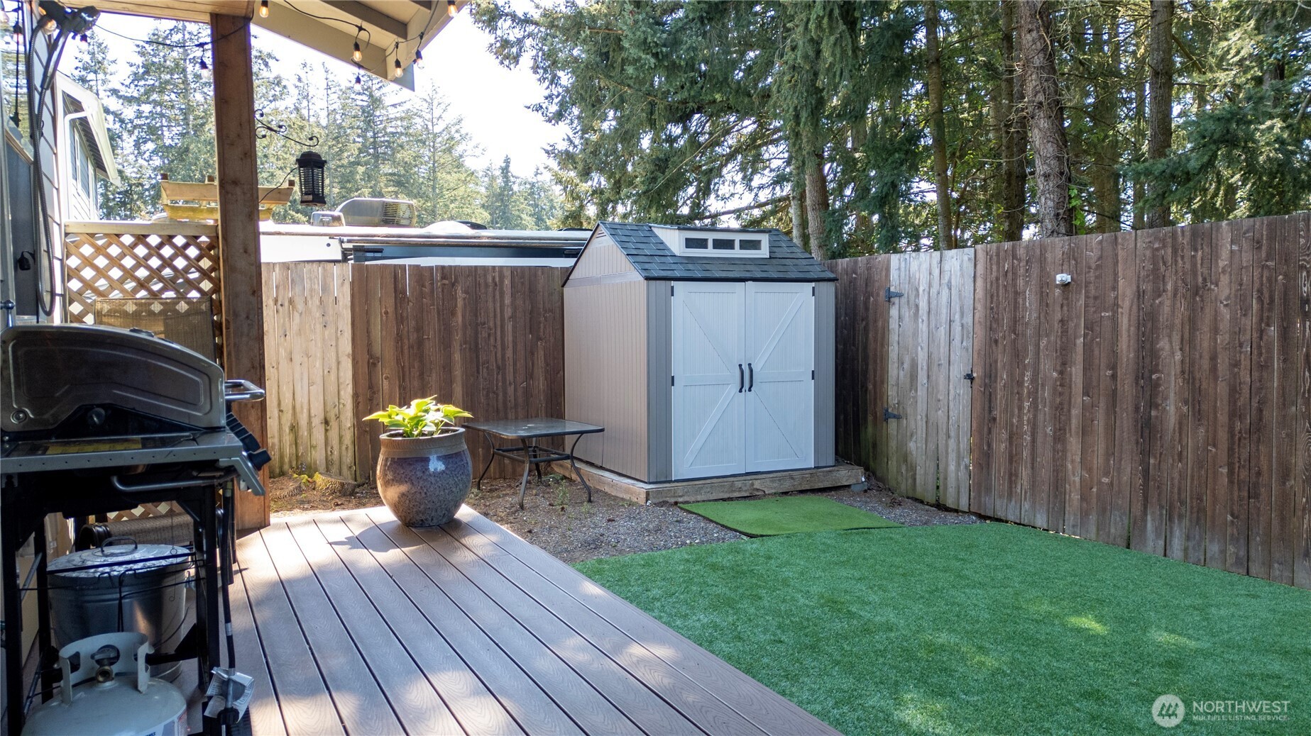 116 Alameda Avenue Fircrest, WA 98466 - Photo 31 of 33 a view of backyard with table and chairs and wooden fence