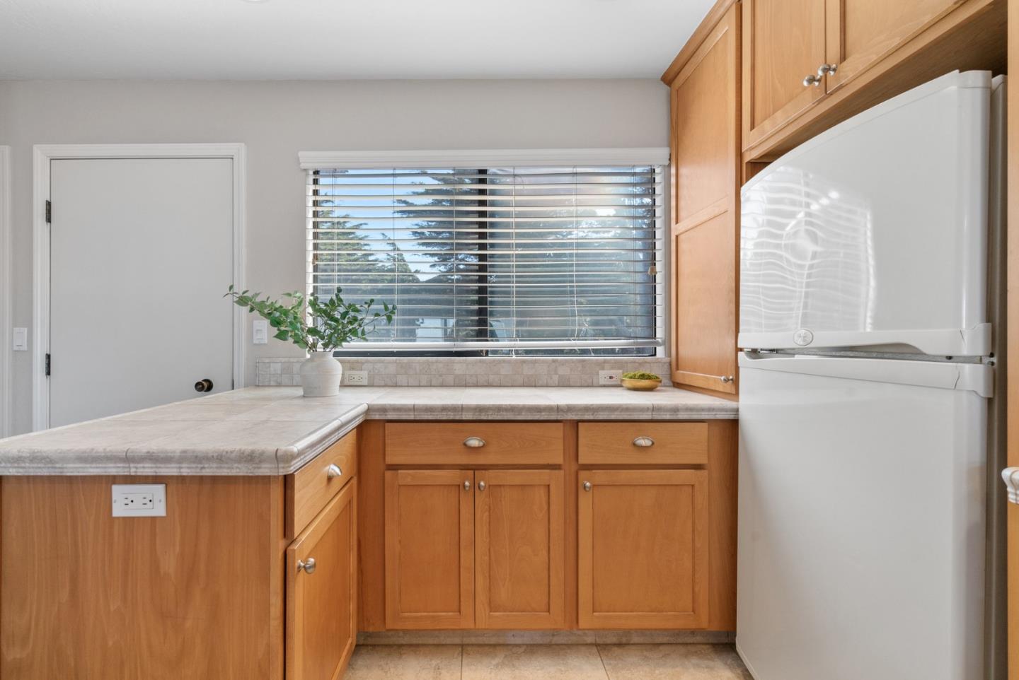 101 Shell Road, Unit 64 Watsonville, CA 95076 - Photo 14 of 35 a bathroom with a granite countertop sink and a window