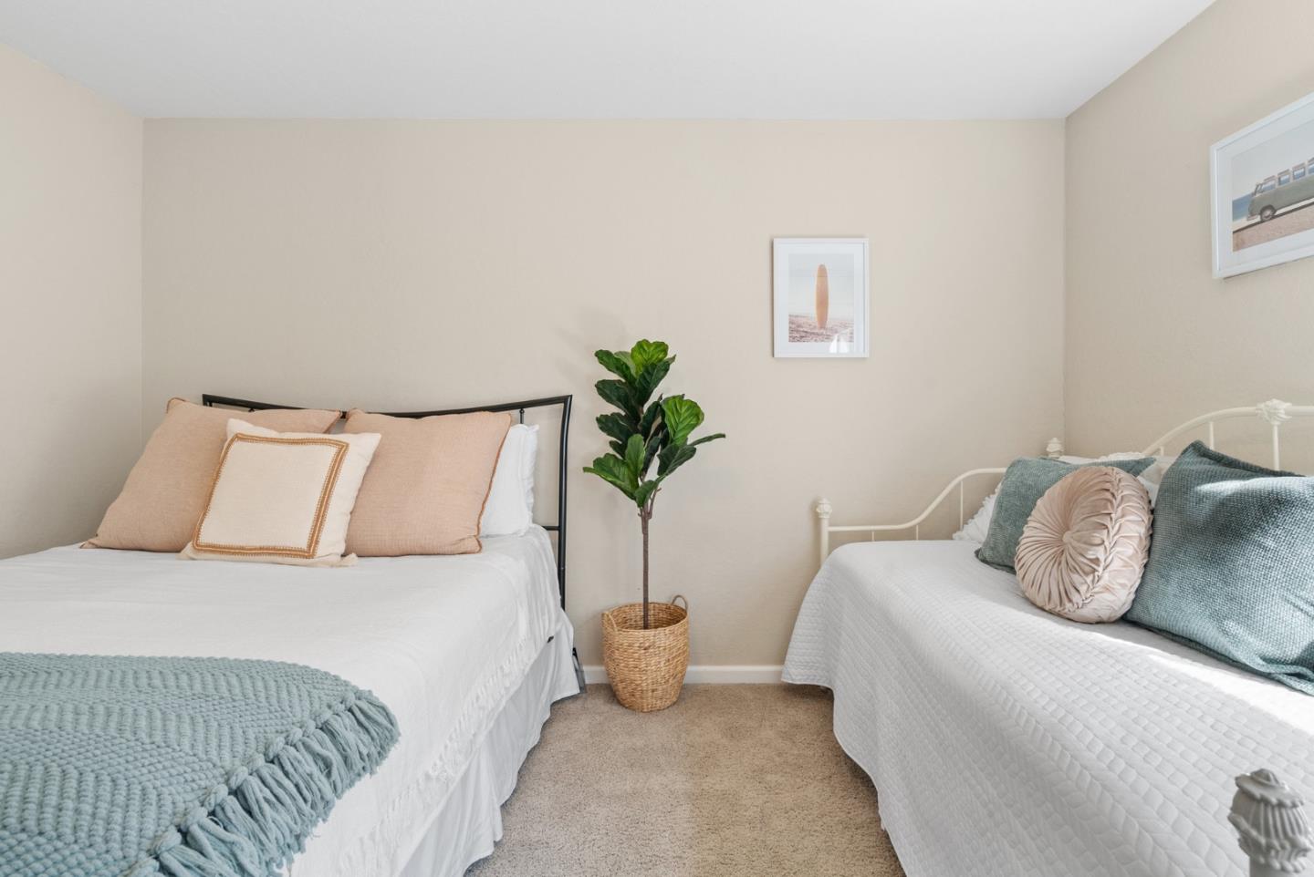 101 Shell Road, Unit 64 Watsonville, CA 95076 - Photo 16 of 35 a bedroom with a bed and a potted plant