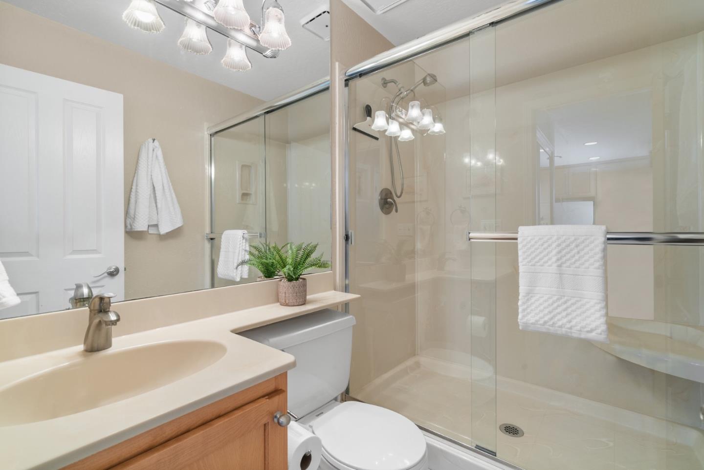 101 Shell Road, Unit 64 Watsonville, CA 95076 - Photo 17 of 35 a bathroom with a sink toilet a mirror and shower