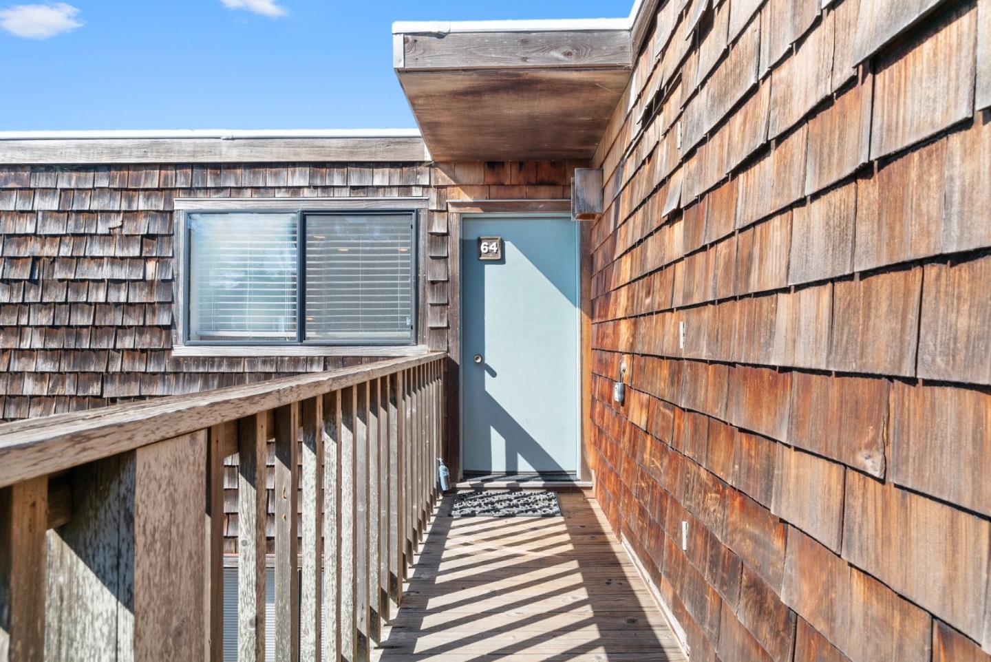 101 Shell Road, Unit 64 Watsonville, CA 95076 - Photo 3 of 35 a view of balcony with wooden floor and stairs