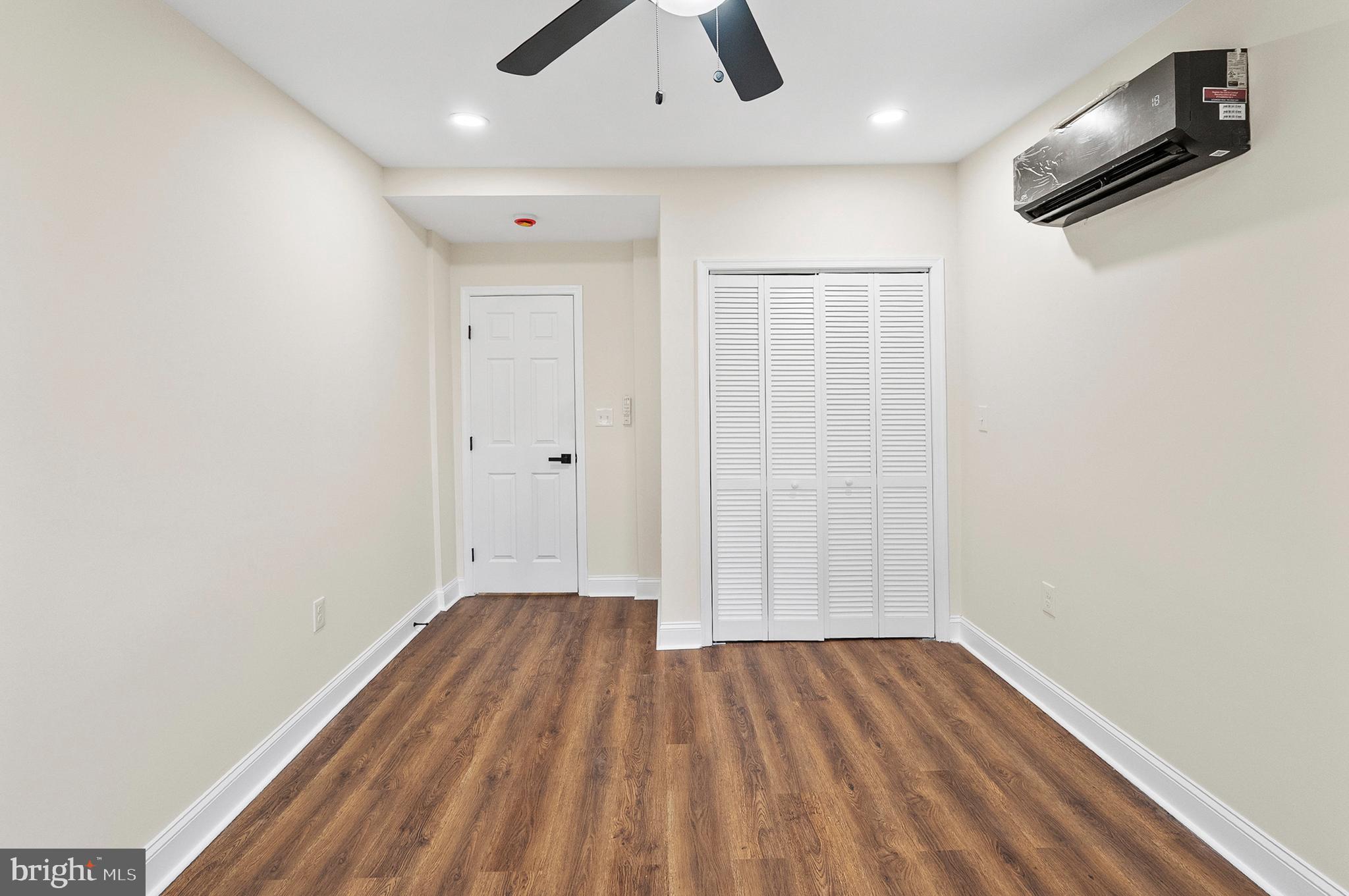 323 South Stricker Street Baltimore, MD 21223 - Photo 28 of 39 wooden floor in an empty room