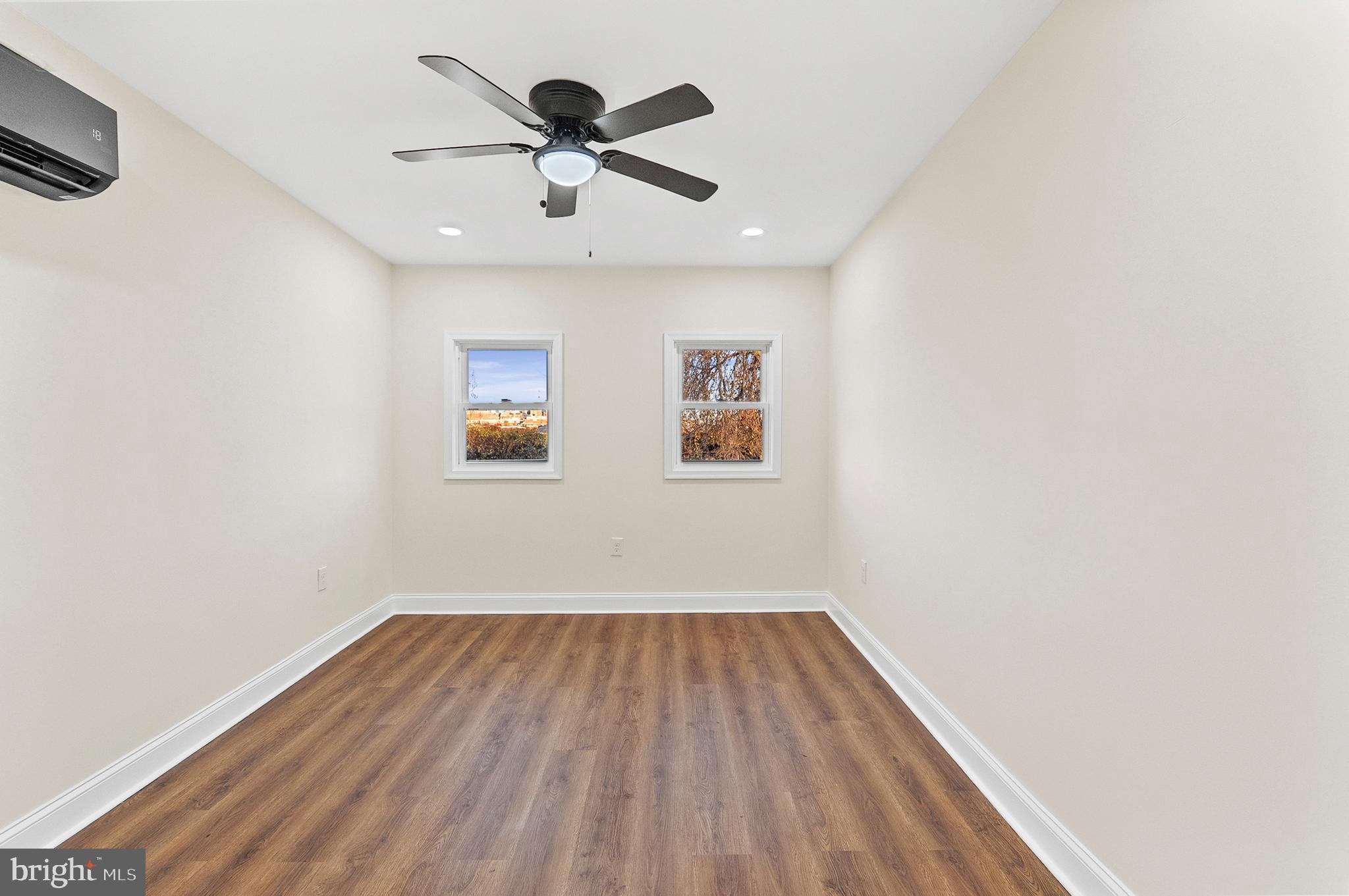 323 South Stricker Street Baltimore, MD 21223 - Photo 29 of 39 a view of empty room with wooden floor