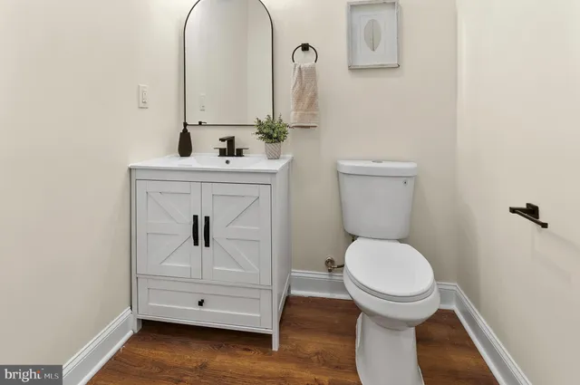 a bathroom with a toilet sink and shower