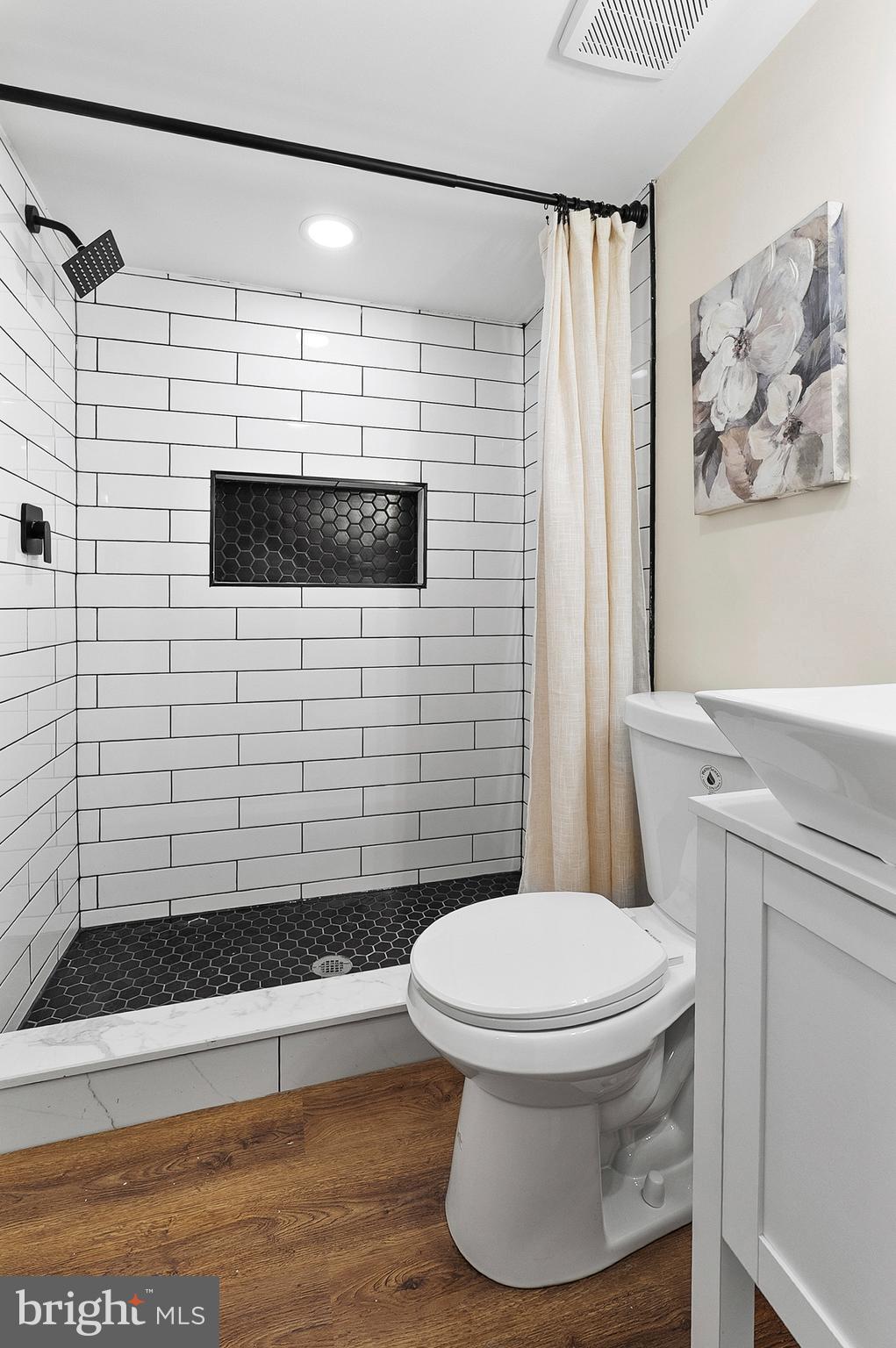 323 South Stricker Street Baltimore, MD 21223 - Photo 32 of 39 a bathroom with a toilet and a shower