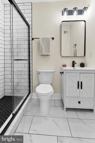 a bedroom with a bed and a chair