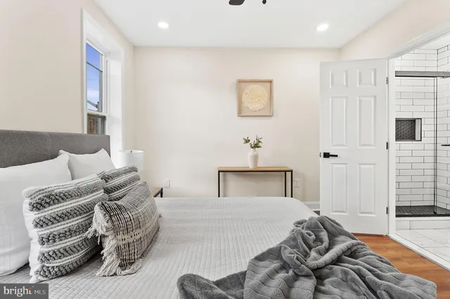 a bedroom with a bed and a view of bathroom