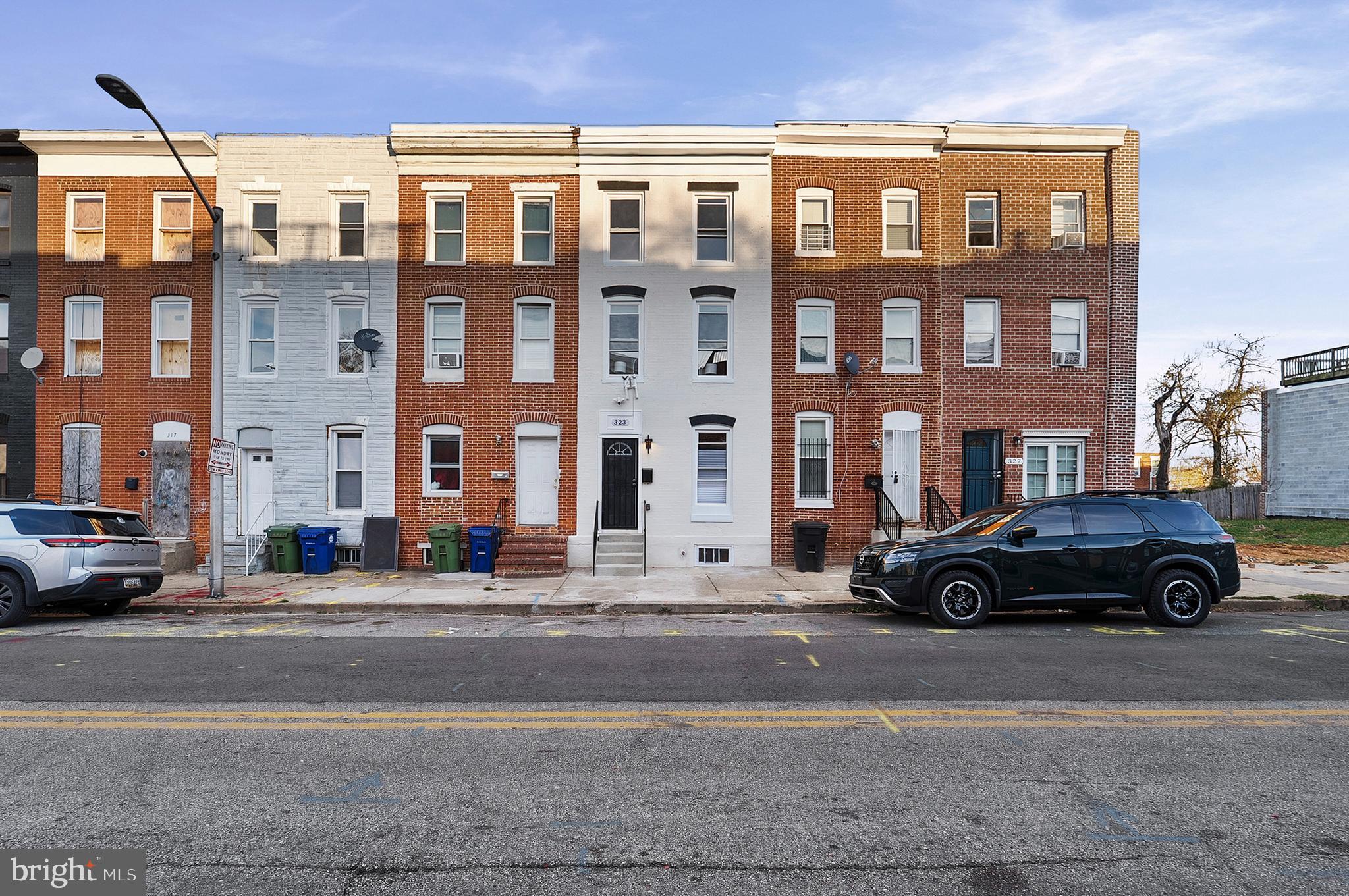 323 South Stricker Street Baltimore, MD 21223 - Photo 37 of 39 a car parked in front of a building
