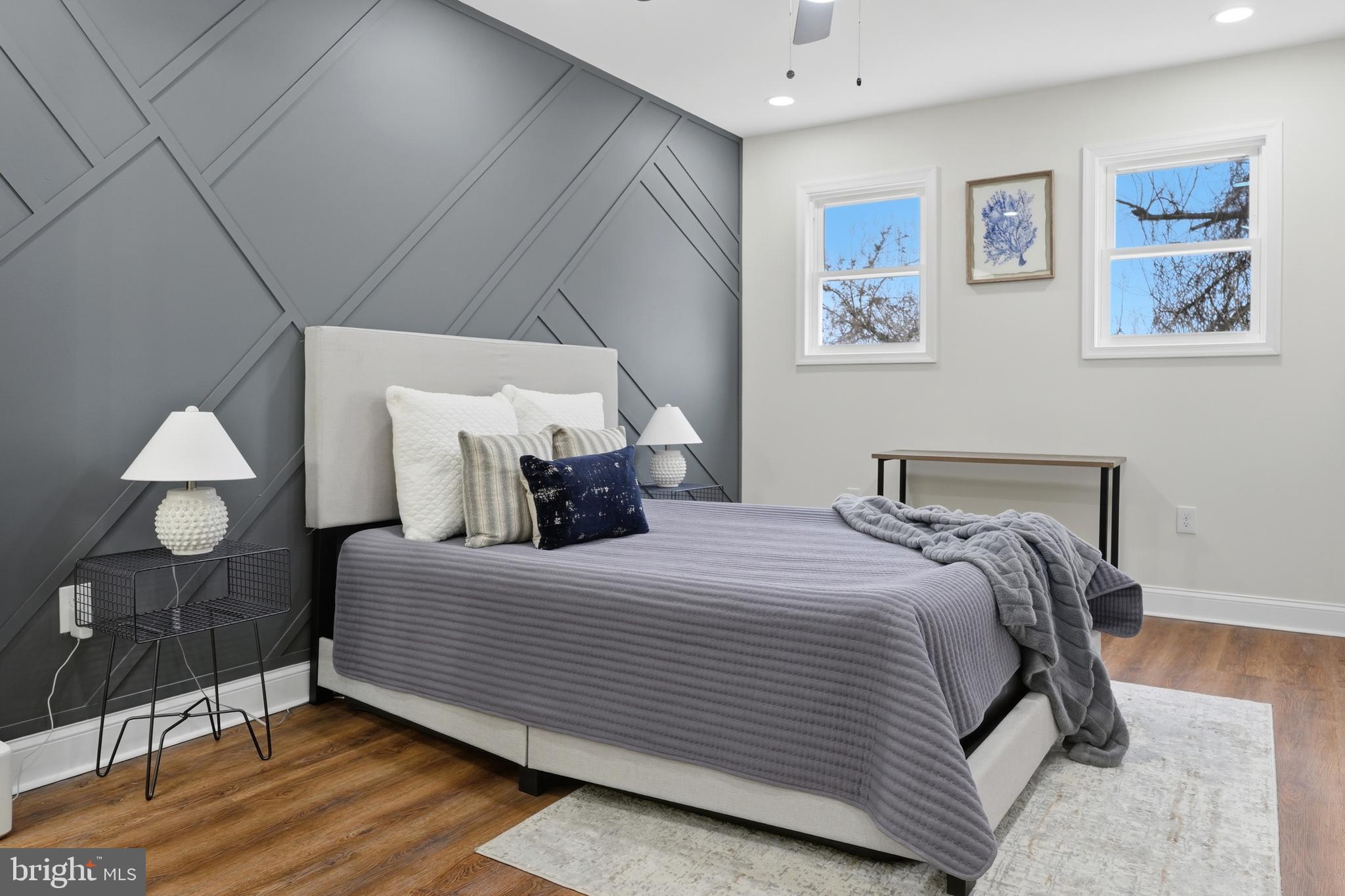 323 South Stricker Street Baltimore, MD 21223 - Photo 7 of 39 a bedroom with a bed and a lamp