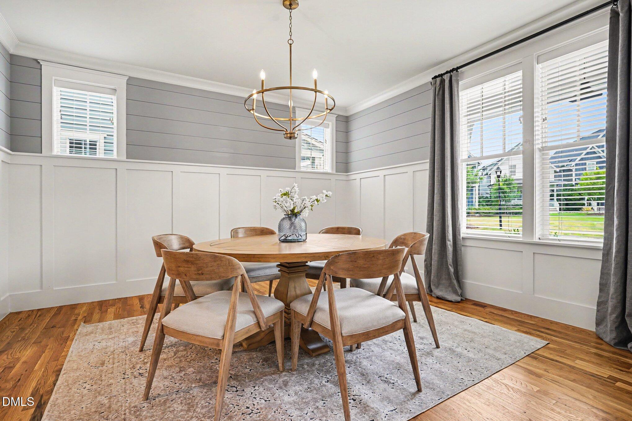824 Watercolor Way Durham, NC 27713 - Photo 7 of 28 a view of a dining room with furniture window and wooden floor
