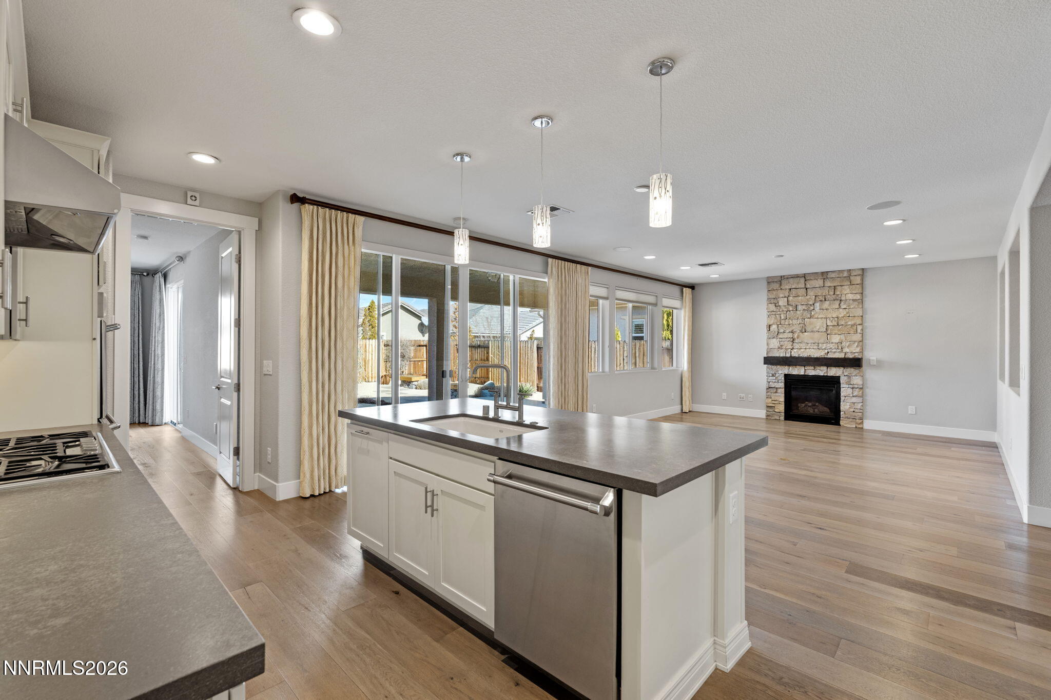9785 Hafflinger Lane Reno, NV 89521 - Photo 14 of 34 a kitchen with sink stove and refrigerator