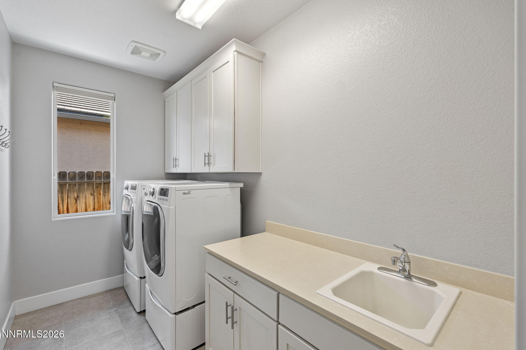 9785 Hafflinger Lane Reno, NV 89521 - Photo 21 of 34 a utility room with dryer and washer