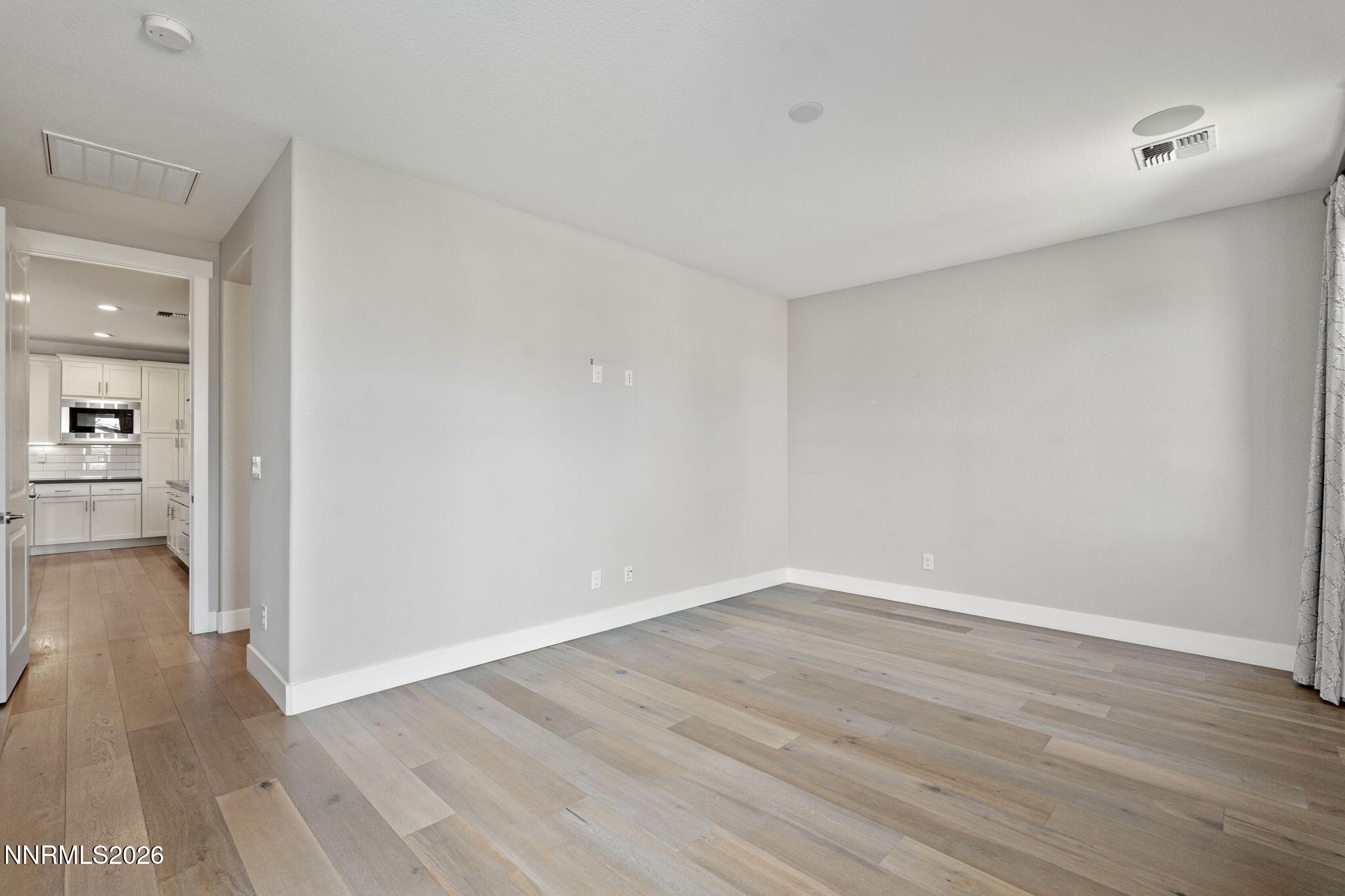 9785 Hafflinger Lane Reno, NV 89521 - Photo 23 of 34 wooden floor in an empty room