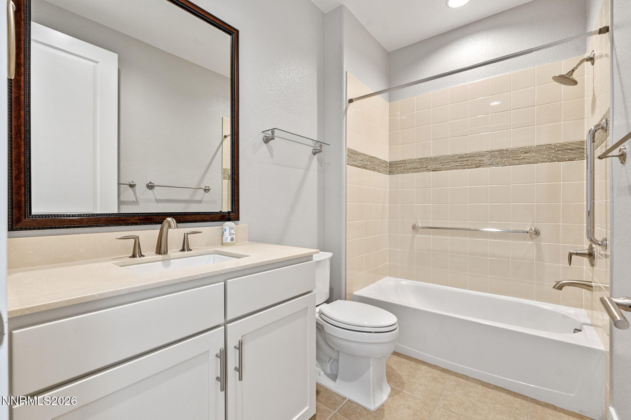 9785 Hafflinger Lane Reno, NV 89521 - Photo 28 of 34 a bathroom with a sink a toilet and shower