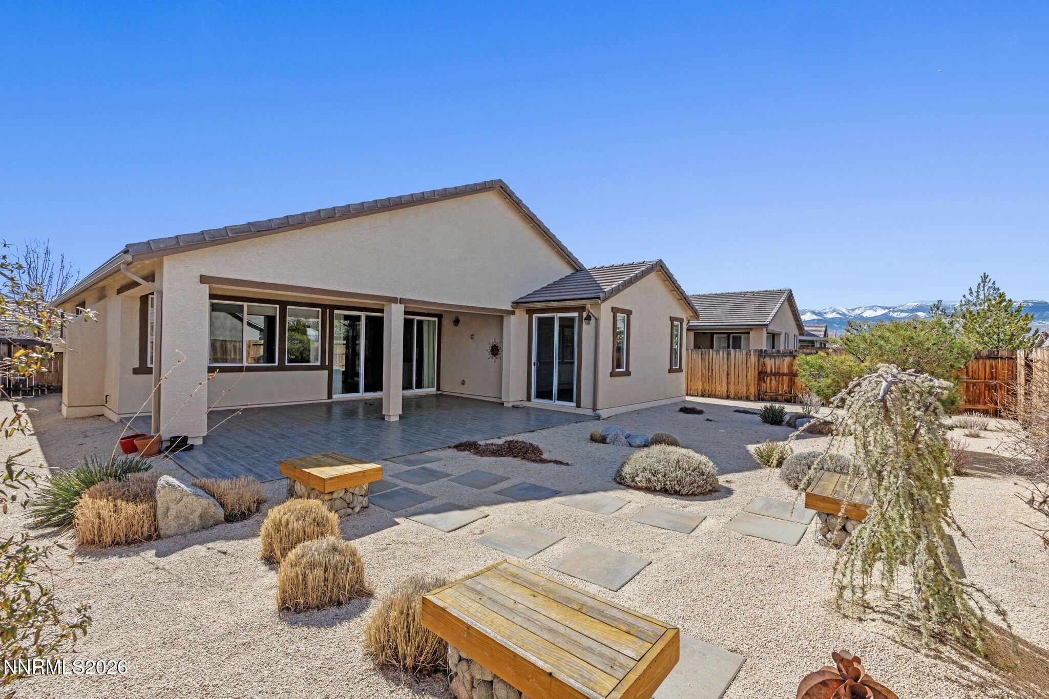 9785 Hafflinger Lane Reno, NV 89521 - Photo 30 of 34 a view of a house with backyard and furniture
