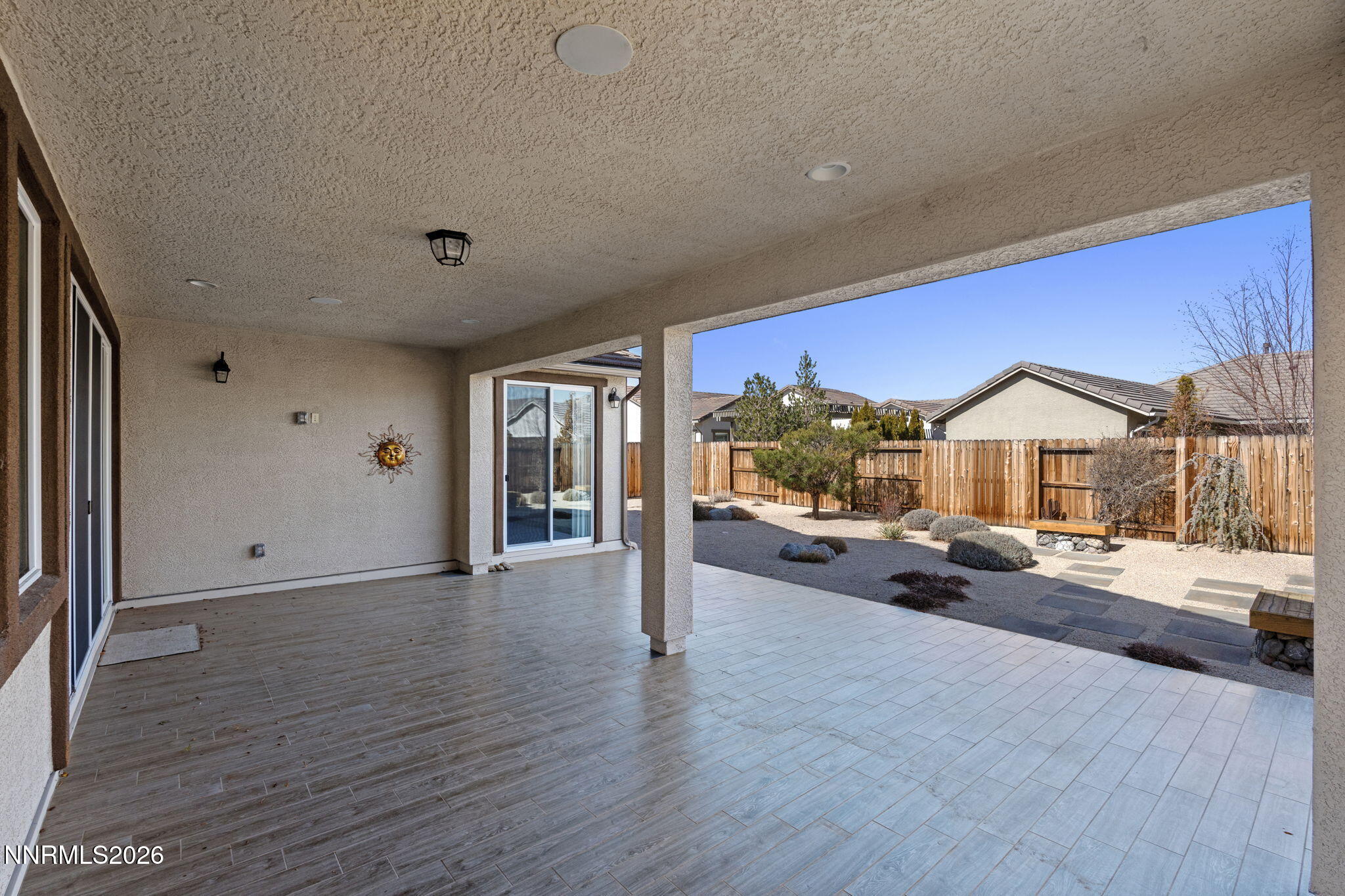 9785 Hafflinger Lane Reno, NV 89521 - Photo 31 of 34 a view of a living room hardwood floor and a ceiling fan