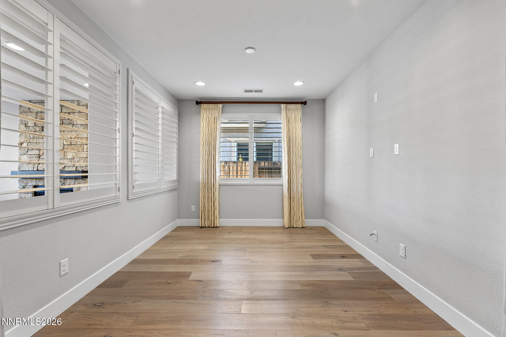 9785 Hafflinger Lane Reno, NV 89521 - Photo 6 of 34 a view of an empty room with a window