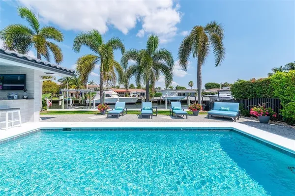 a view of a livingroom with furniture and mirror